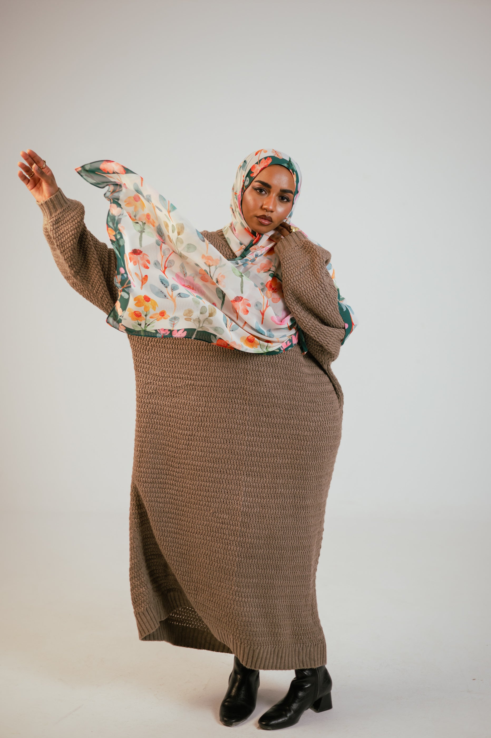 Full-length movement shot of the Blooms of Hope chiffon hijab flowing elegantly as the model poses.
