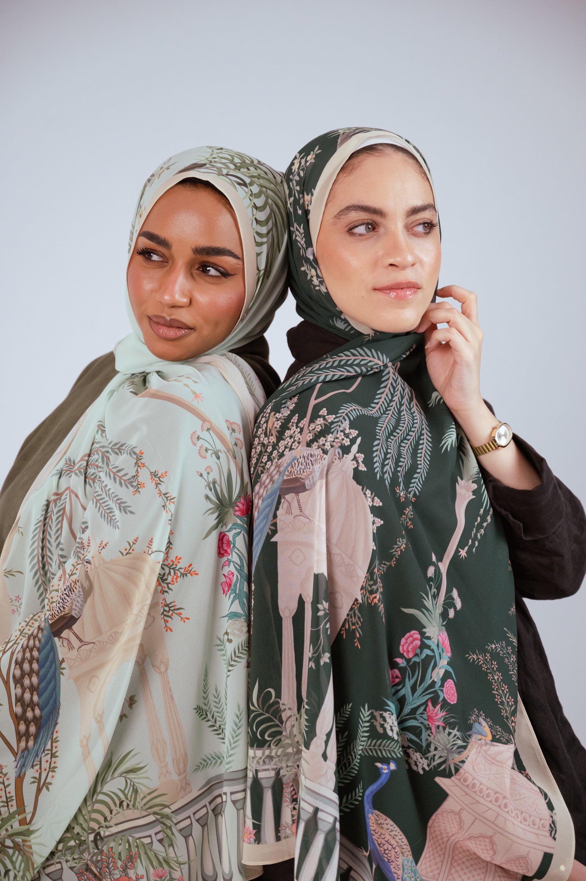 Model wearing Emerald Garden luxury chiffon hijab featuring emerald green garden and peacock design