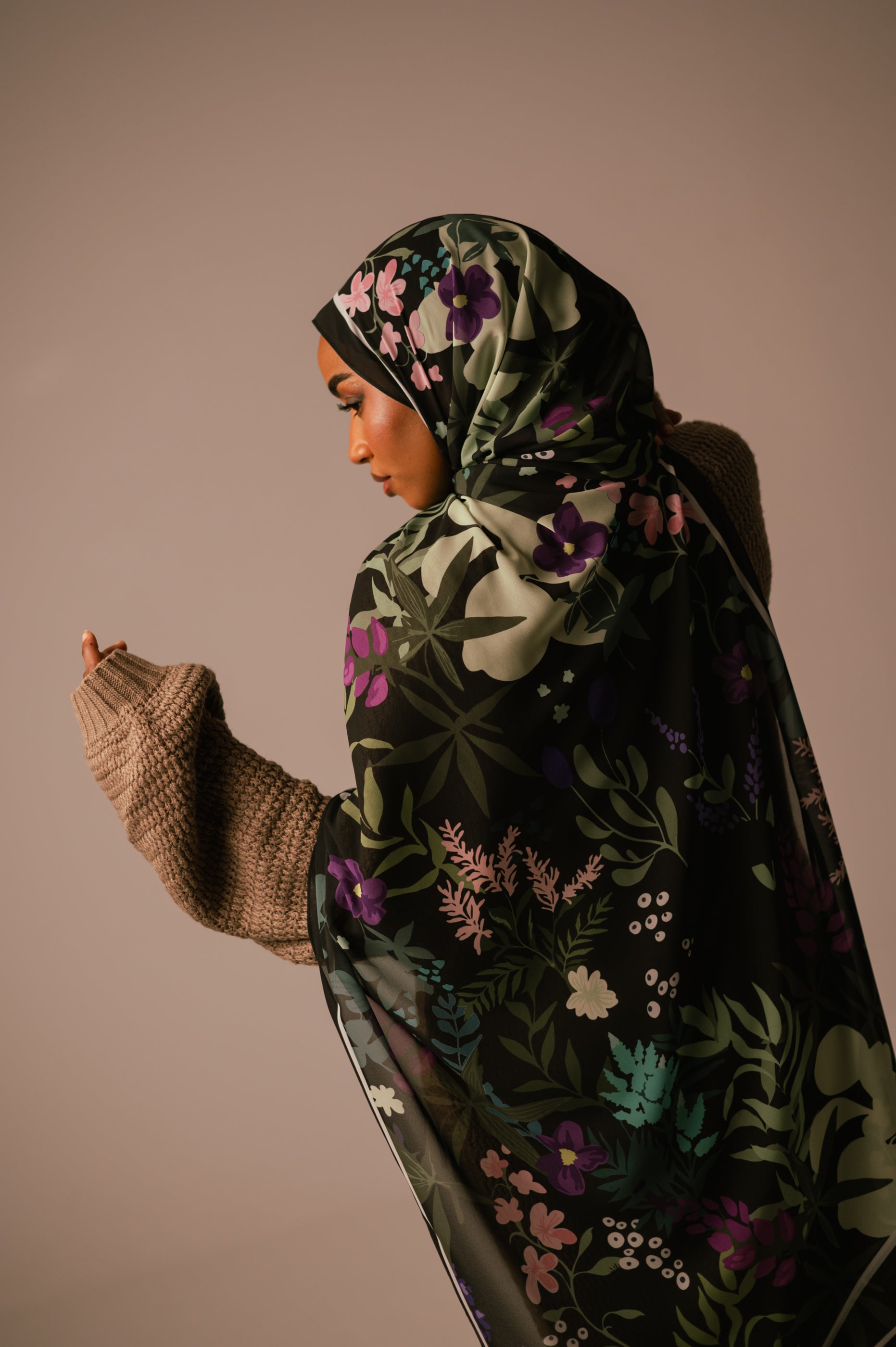 Back view of the Garden of Whispers chiffon hijab draped across the model’s shoulders, showing full print detail.