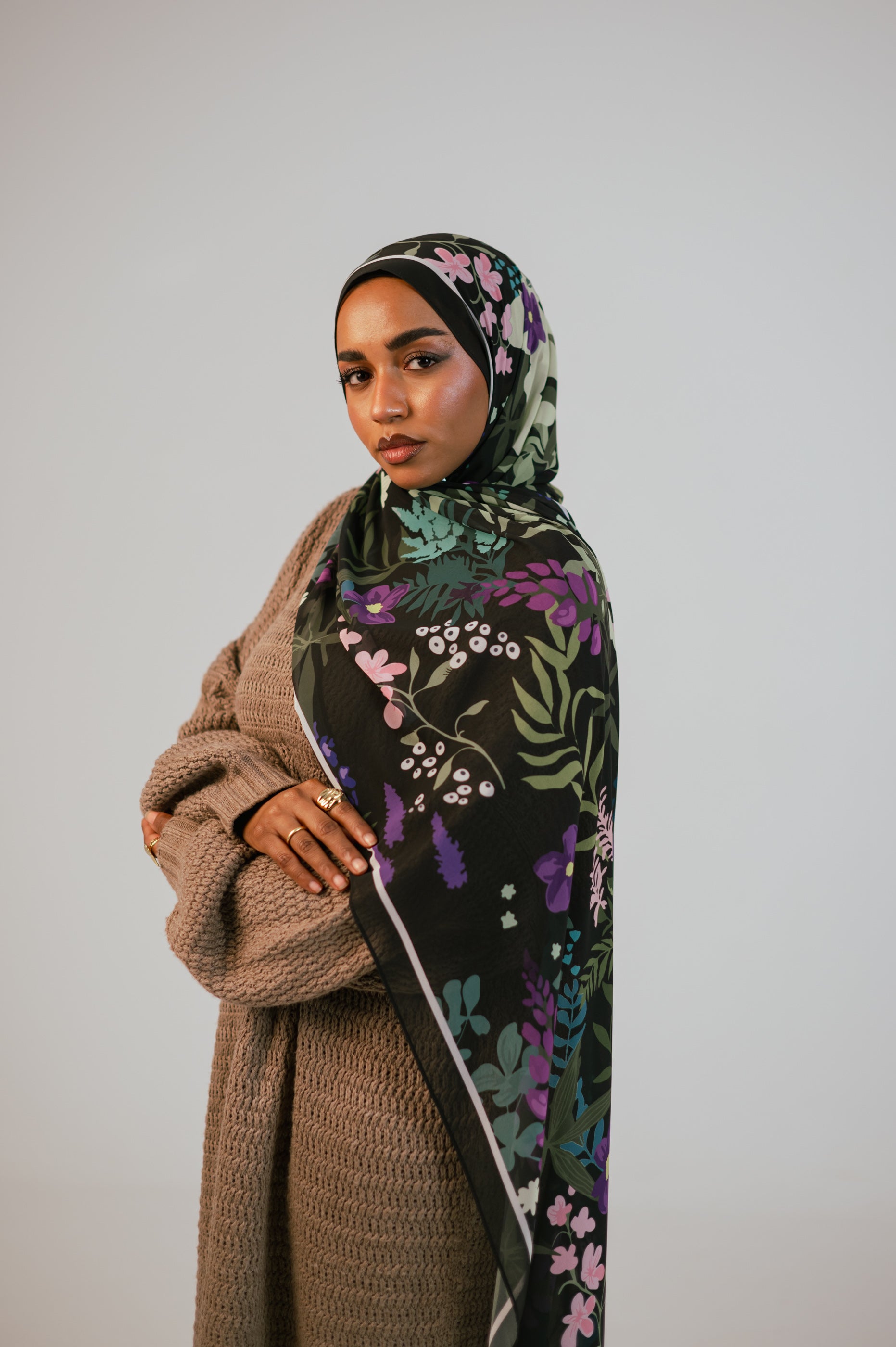 Model wearing the Garden of Whispers chiffon hijab on a clean neutral background, showing the full floral pattern.