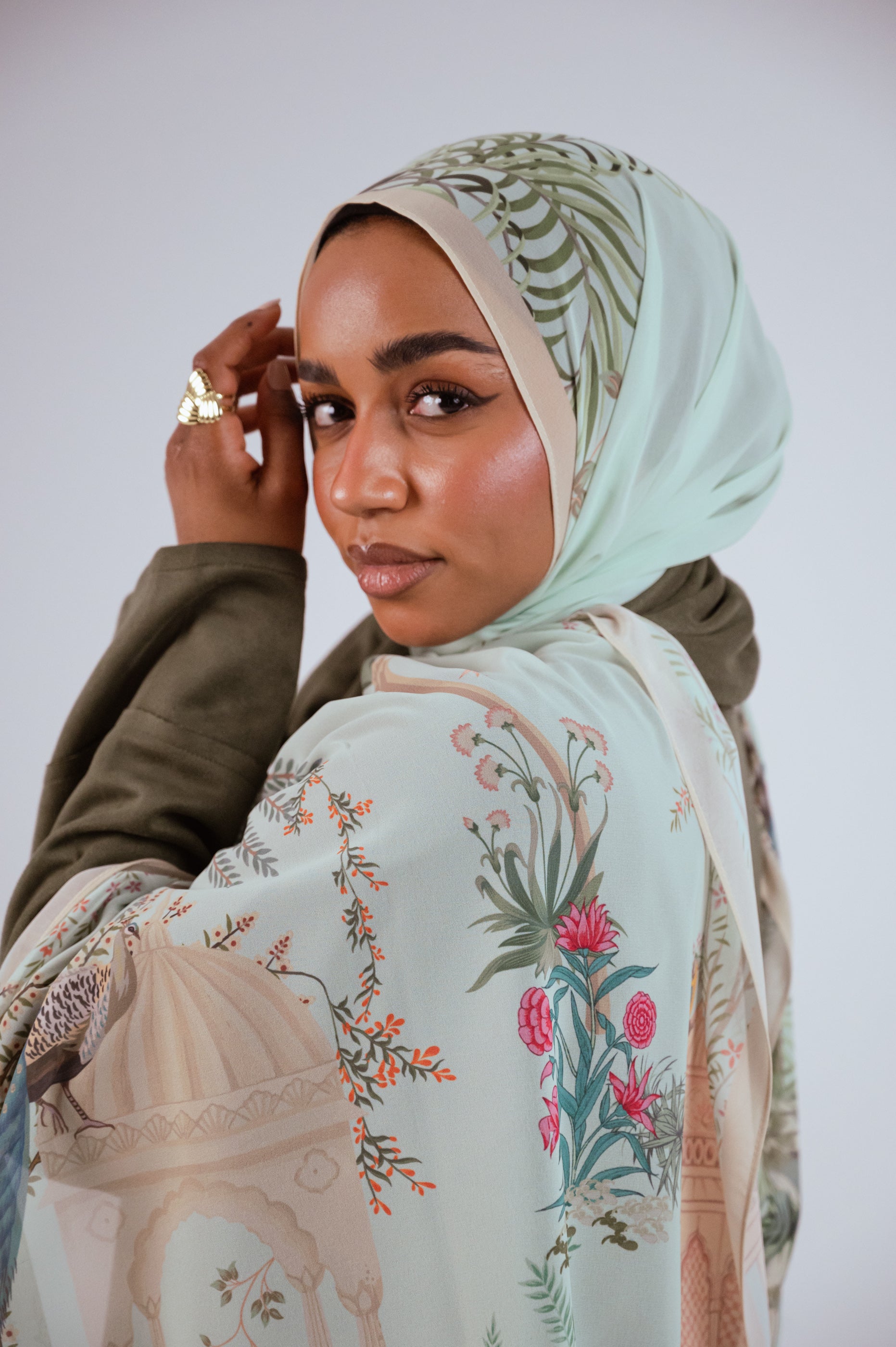 Model wearing Palais de Paon luxury chiffon hijab – mint peacock print by Jaida