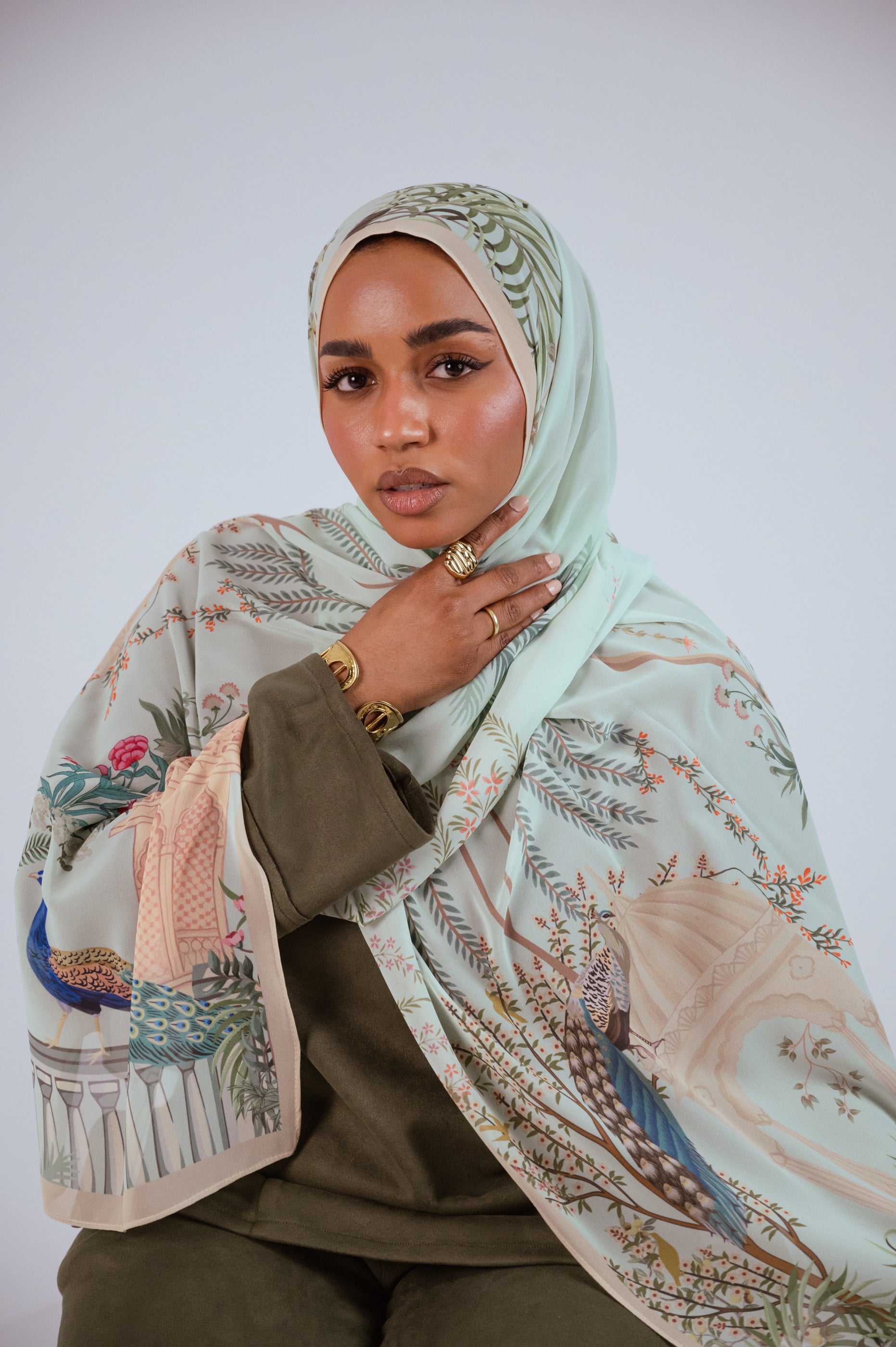 Model wearing Palais de Paon luxury chiffon hijab – mint peacock print by Jaida