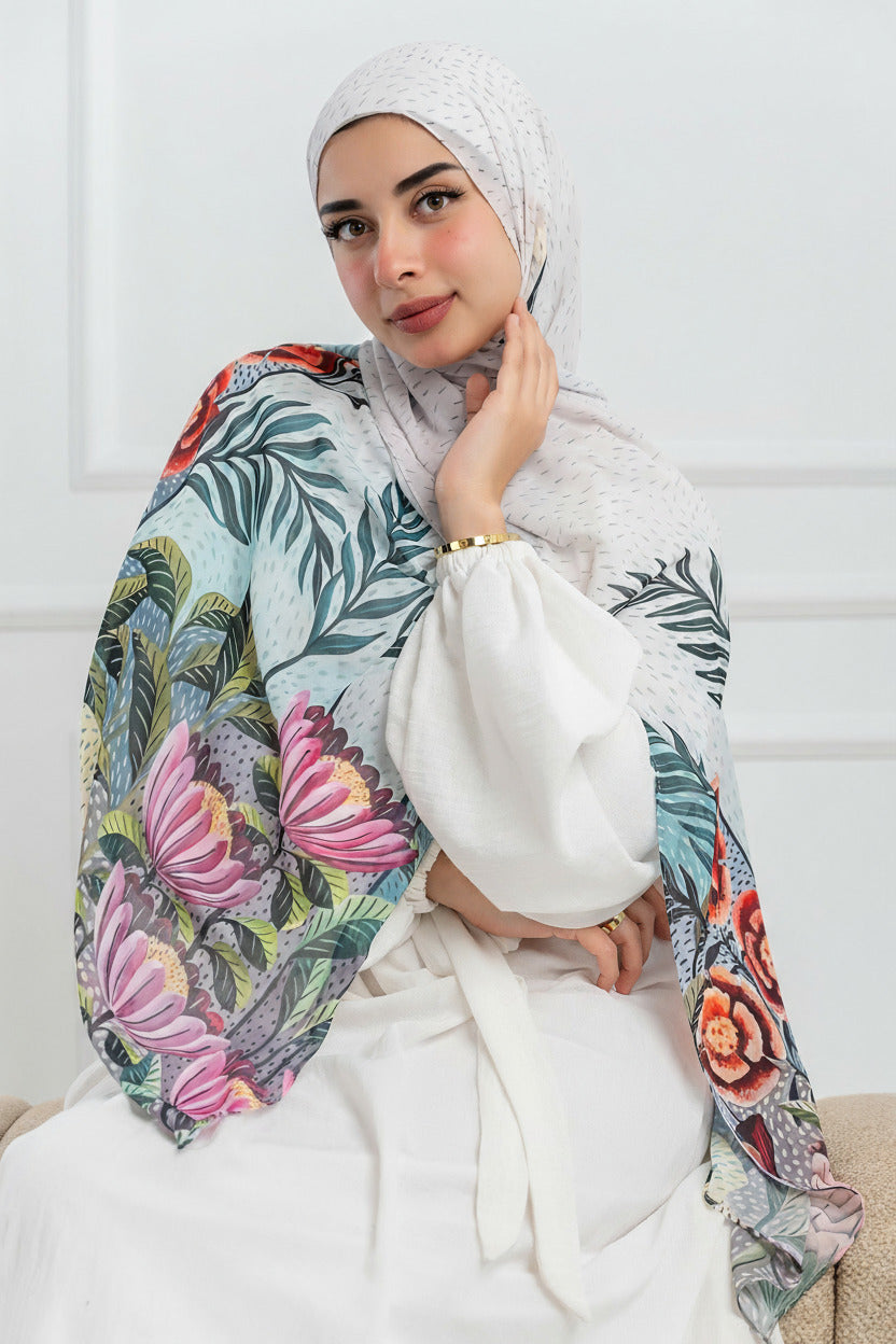 Model wearing Jardin de Lumière luxury chiffon hijab with soft ivory base and floral design – front view