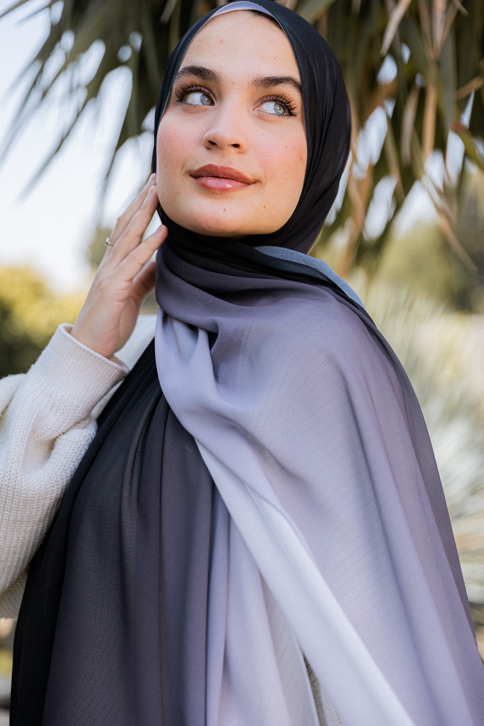 Side view of the Lunar Mist ombré chiffon hijab showing the soft gradient from midnight black to dove grey