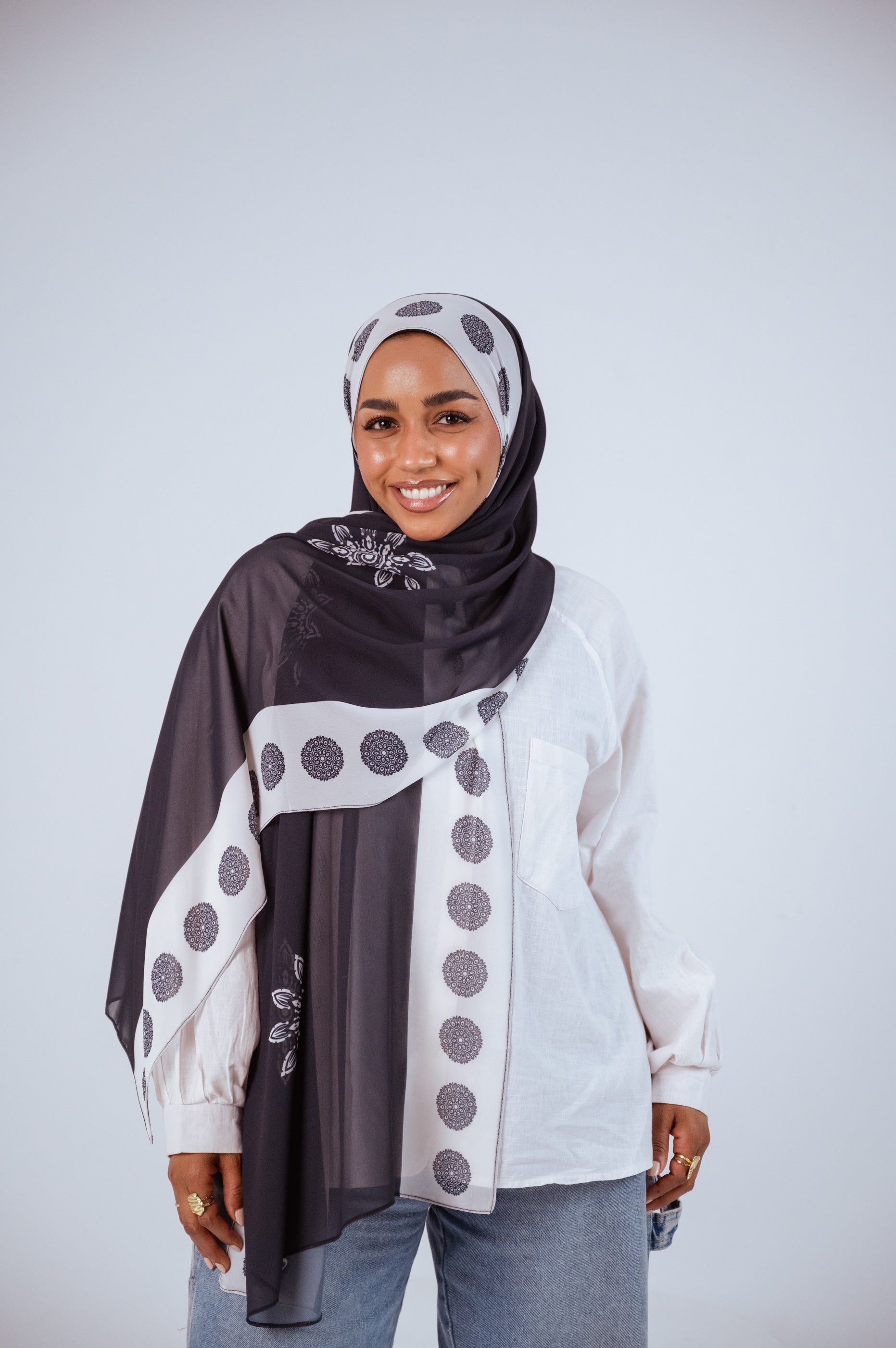 Midnight Mandala chiffon hijab styled in a classic wrap, charcoal with mandala detailing.