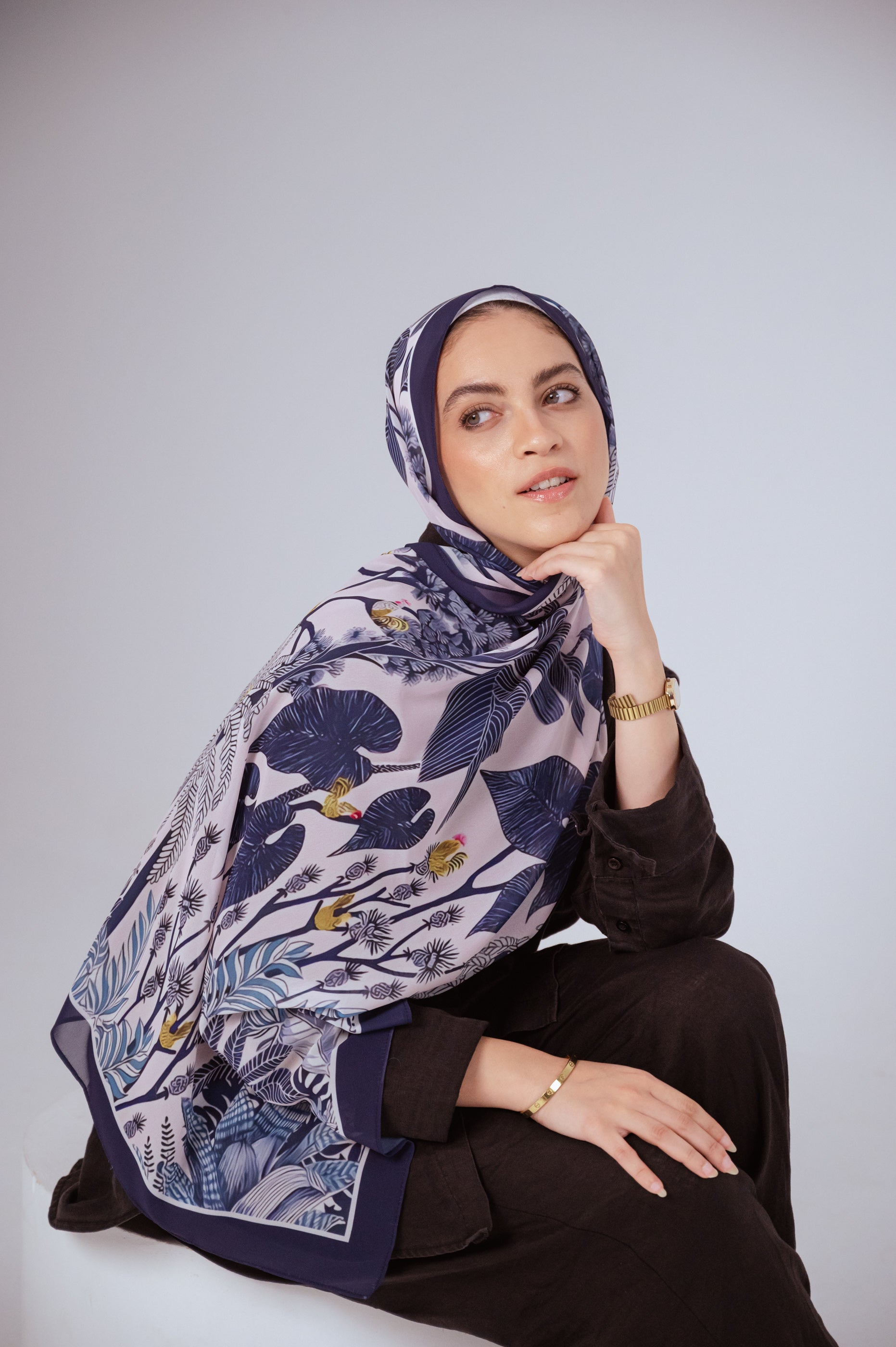 Model wearing Moonlight Oasis chiffon hijab – front view with navy and silver botanical print