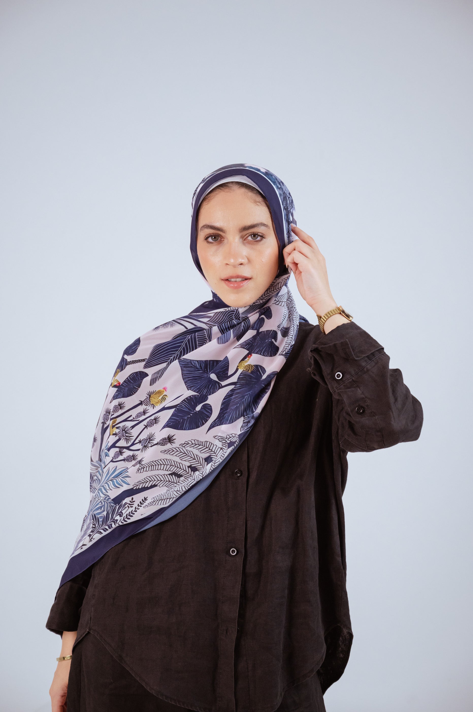 Model wearing Moonlight Oasis chiffon hijab – front view with navy and silver botanical print