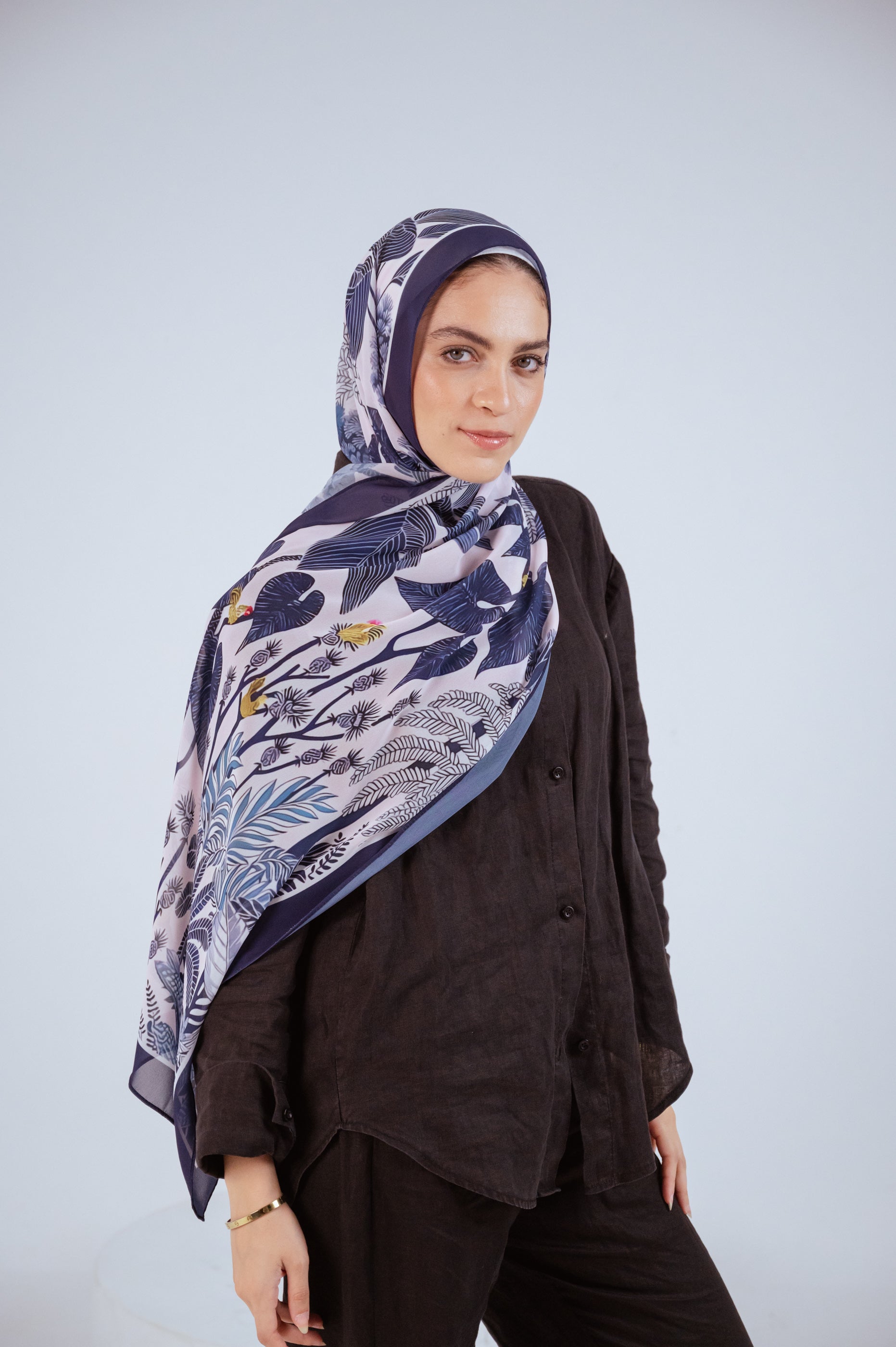 Model wearing Moonlight Oasis chiffon hijab – front view with navy and silver botanical print