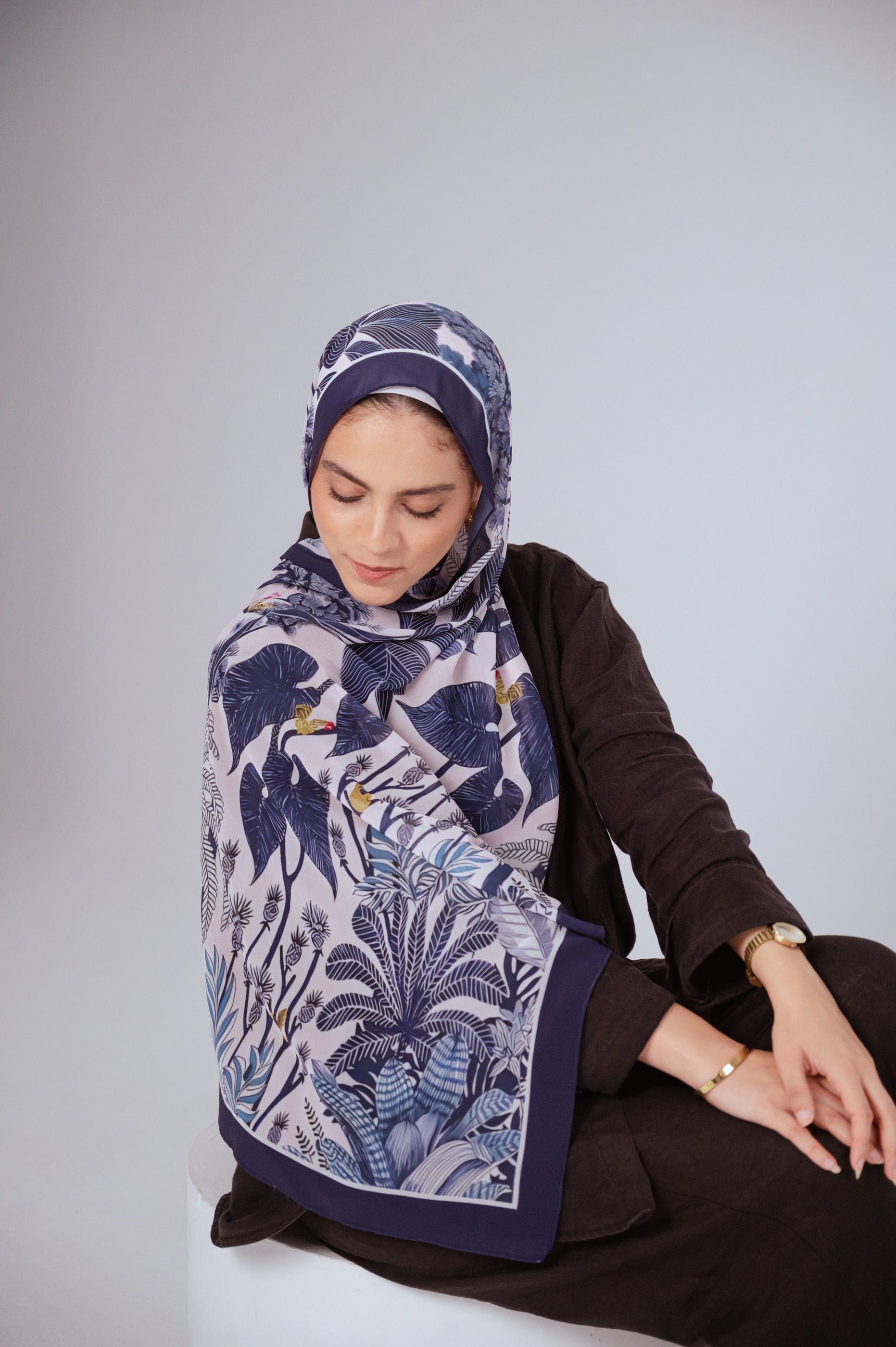 Model wearing Moonlight Oasis chiffon hijab – front view with navy and silver botanical print