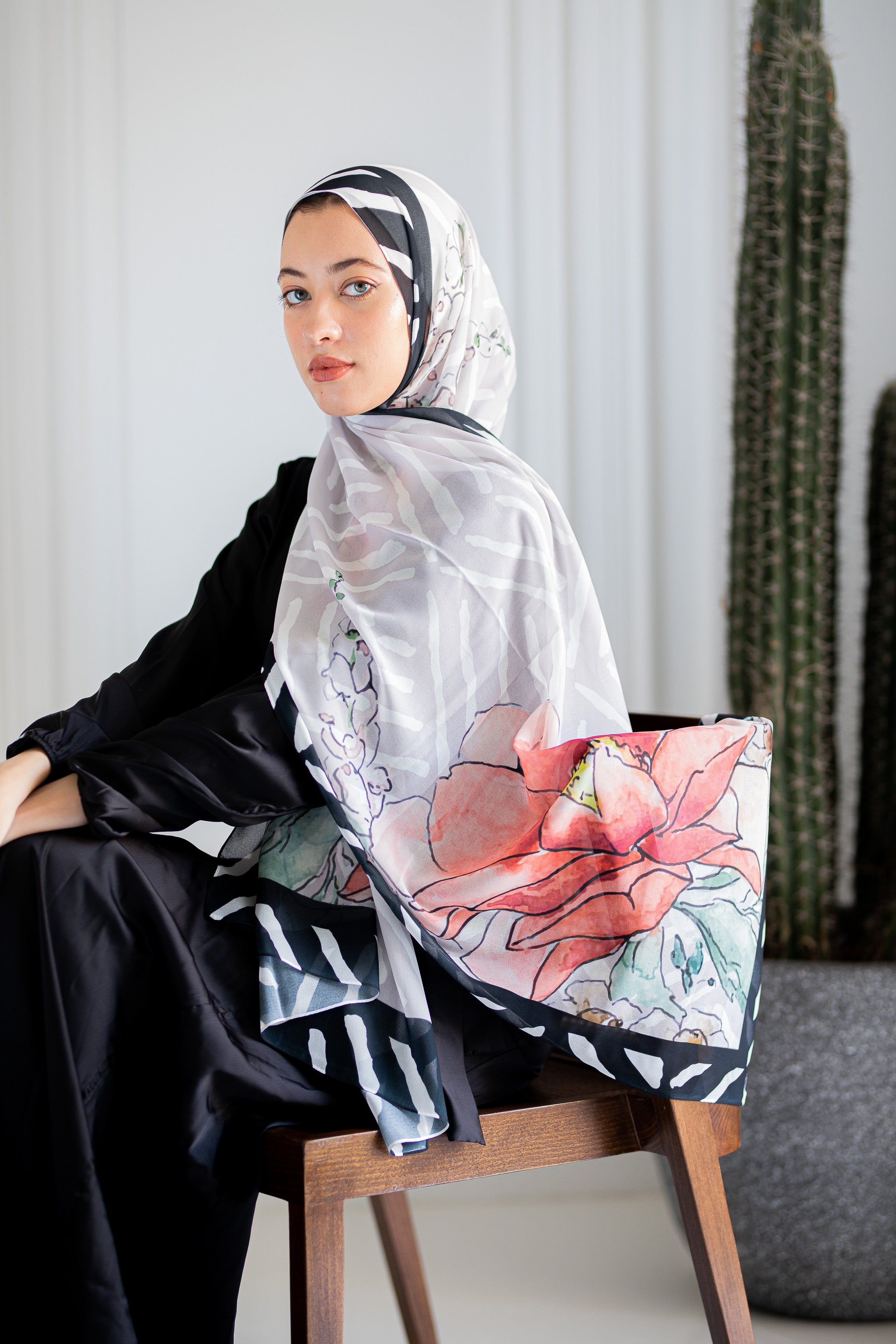 Model wearing Jaida’s Roselle Canvas Luxury Chiffon Hijab, highlighting its painterly floral design and airy chiffon texture.