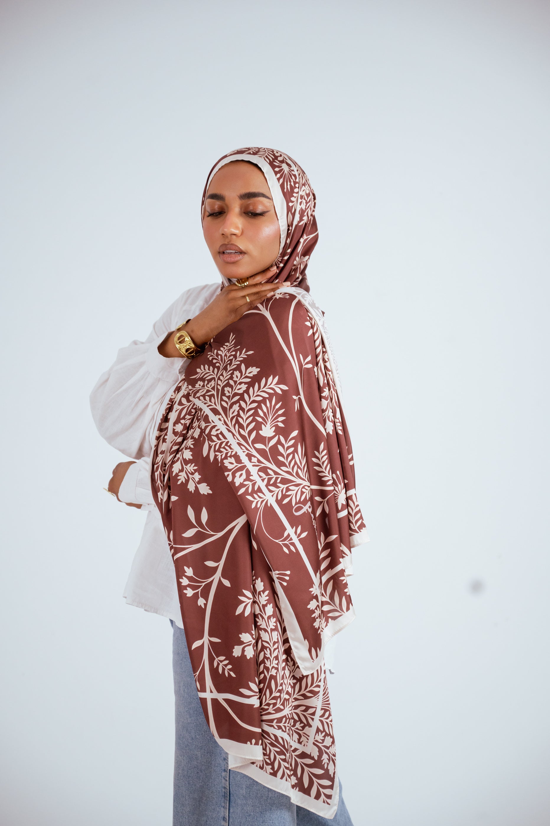 Side view of Rose of Petra satin hijab showcasing botanical print and silky drape.