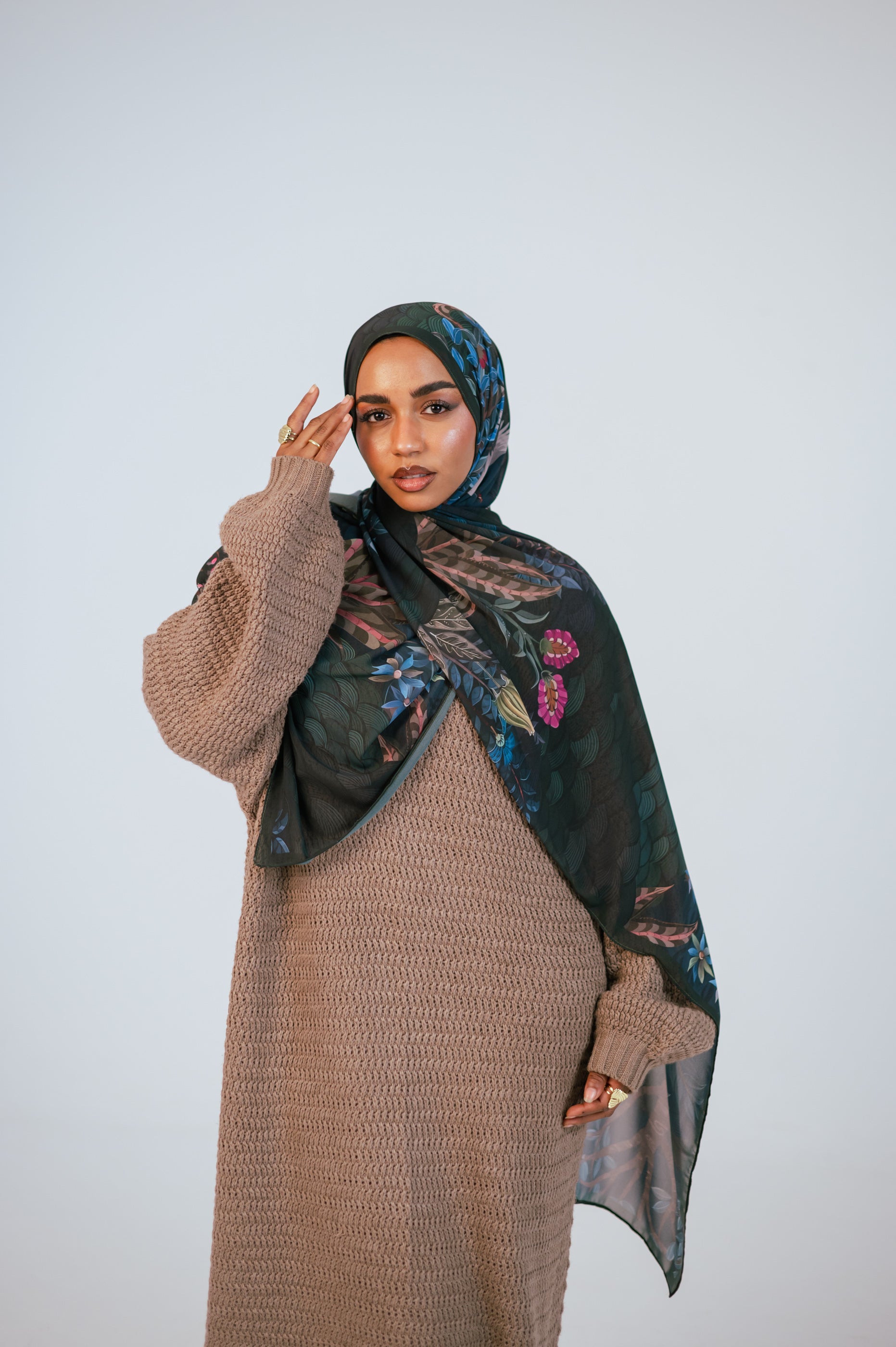 Portrait of model wearing the Secret Garden Luxury Chiffon Hijab highlighting the rich green tones and floral accents.