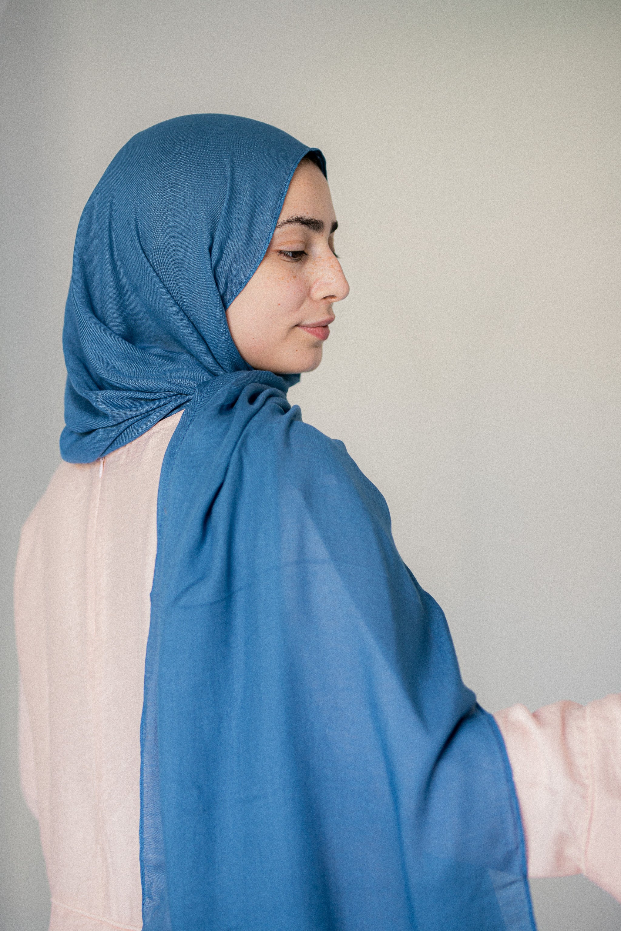 Side profile view of Tidemist Modal Cotton Hijab in light blue drape