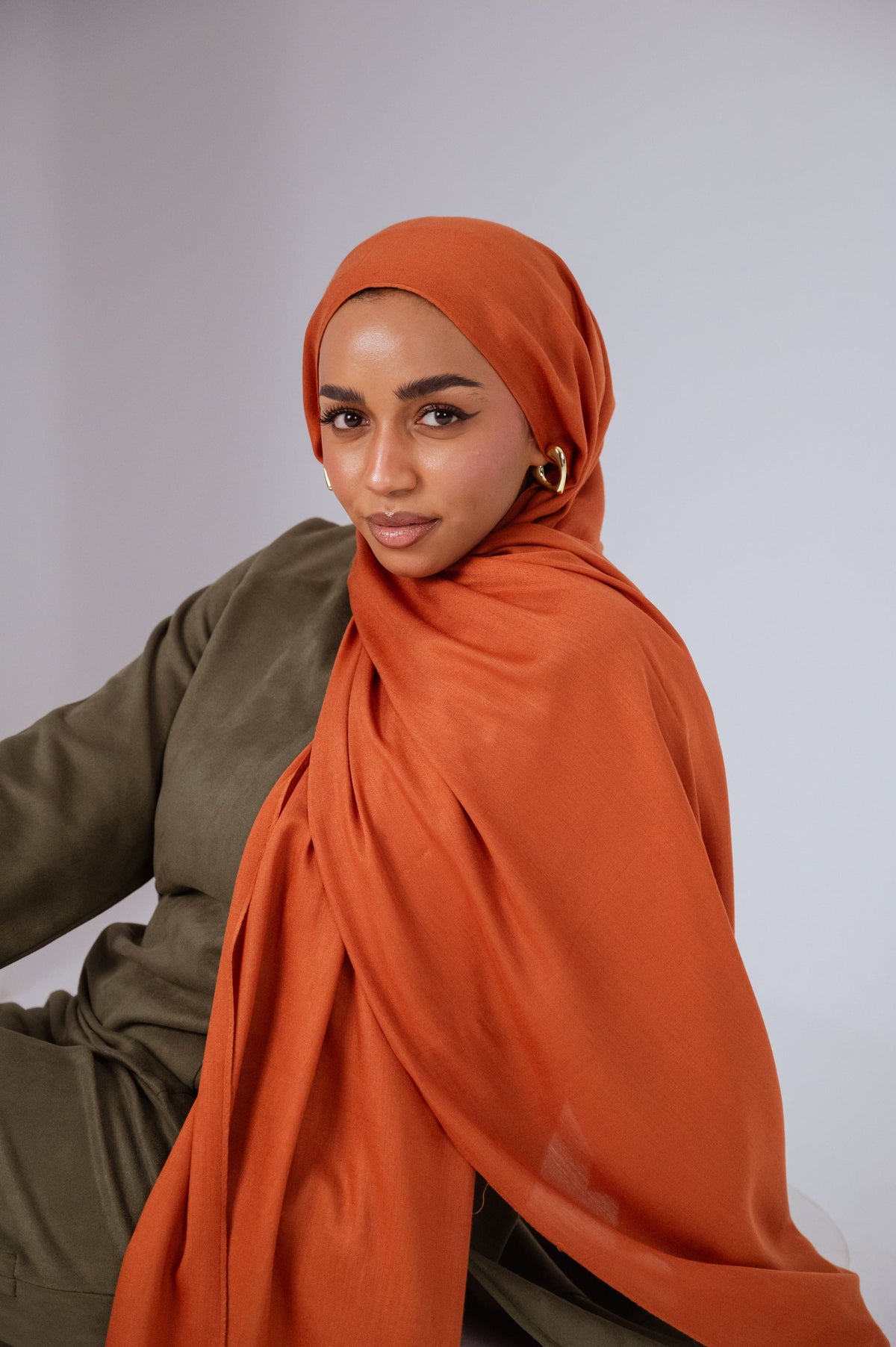 Afire rust modal cotton hijab by JAIDA styled as an autumn fall hijab in Canada