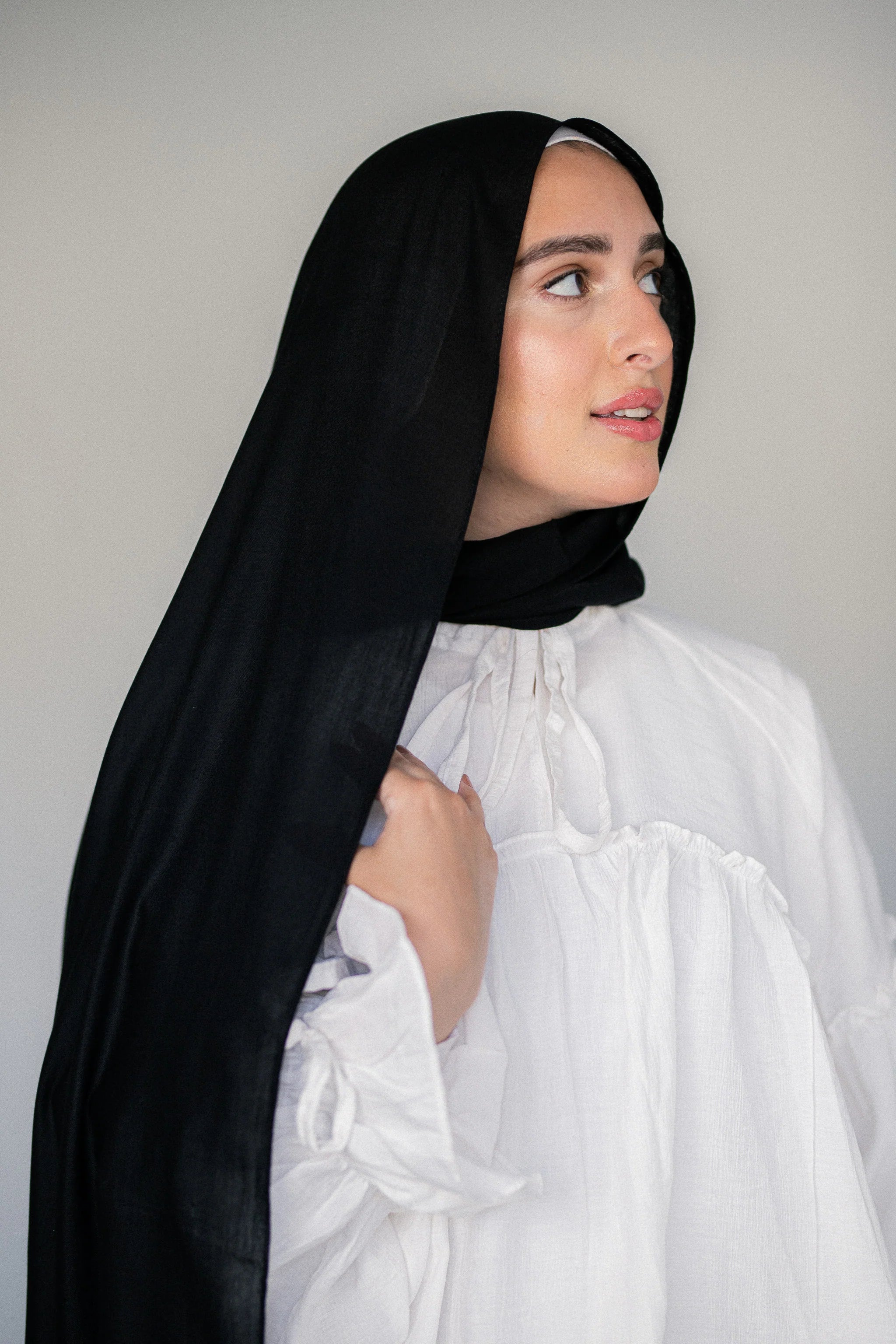 Model Wearing Noir Eclipse Modal Cotton Hijab