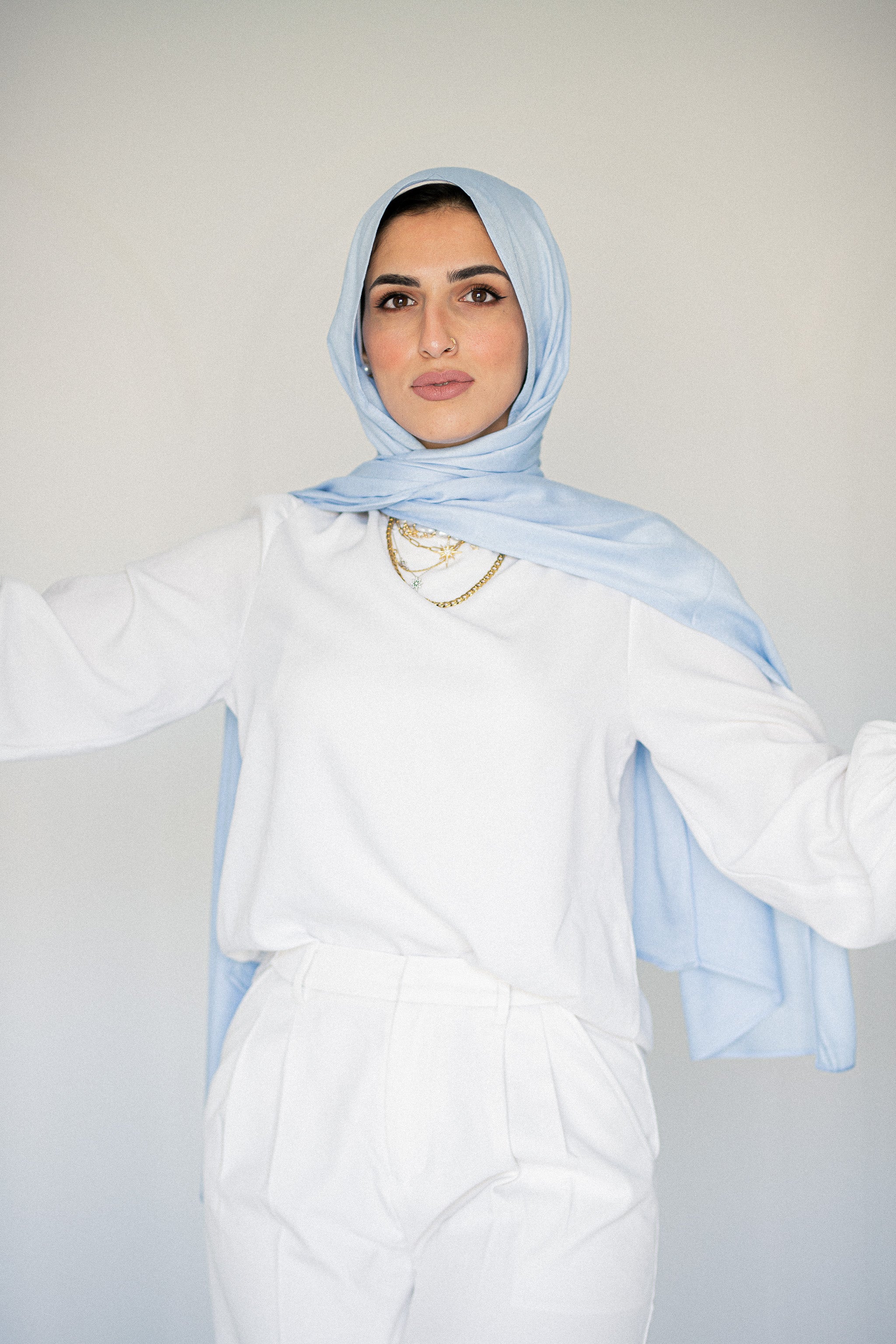 Model wearing Morning Sky hijab, soft baby blue modal cotton