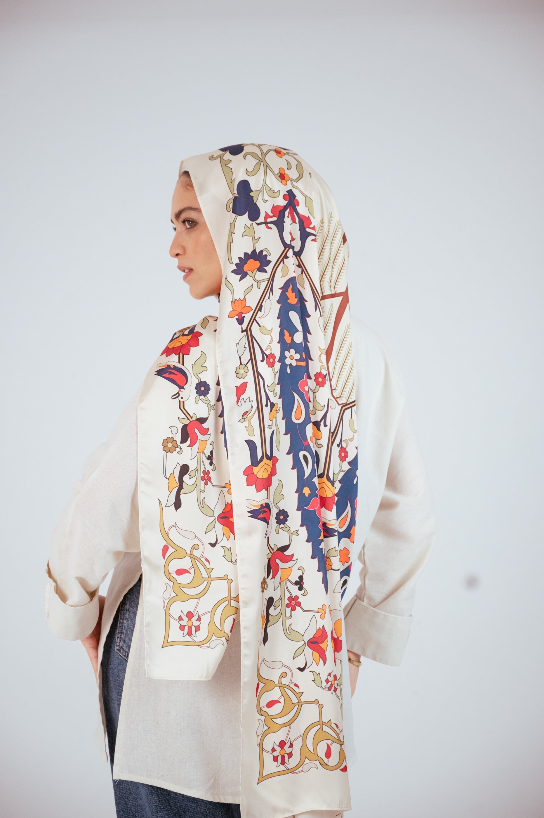 Andalus Satin Hijab styled loosely over the shoulders, highlighting its soft sheen