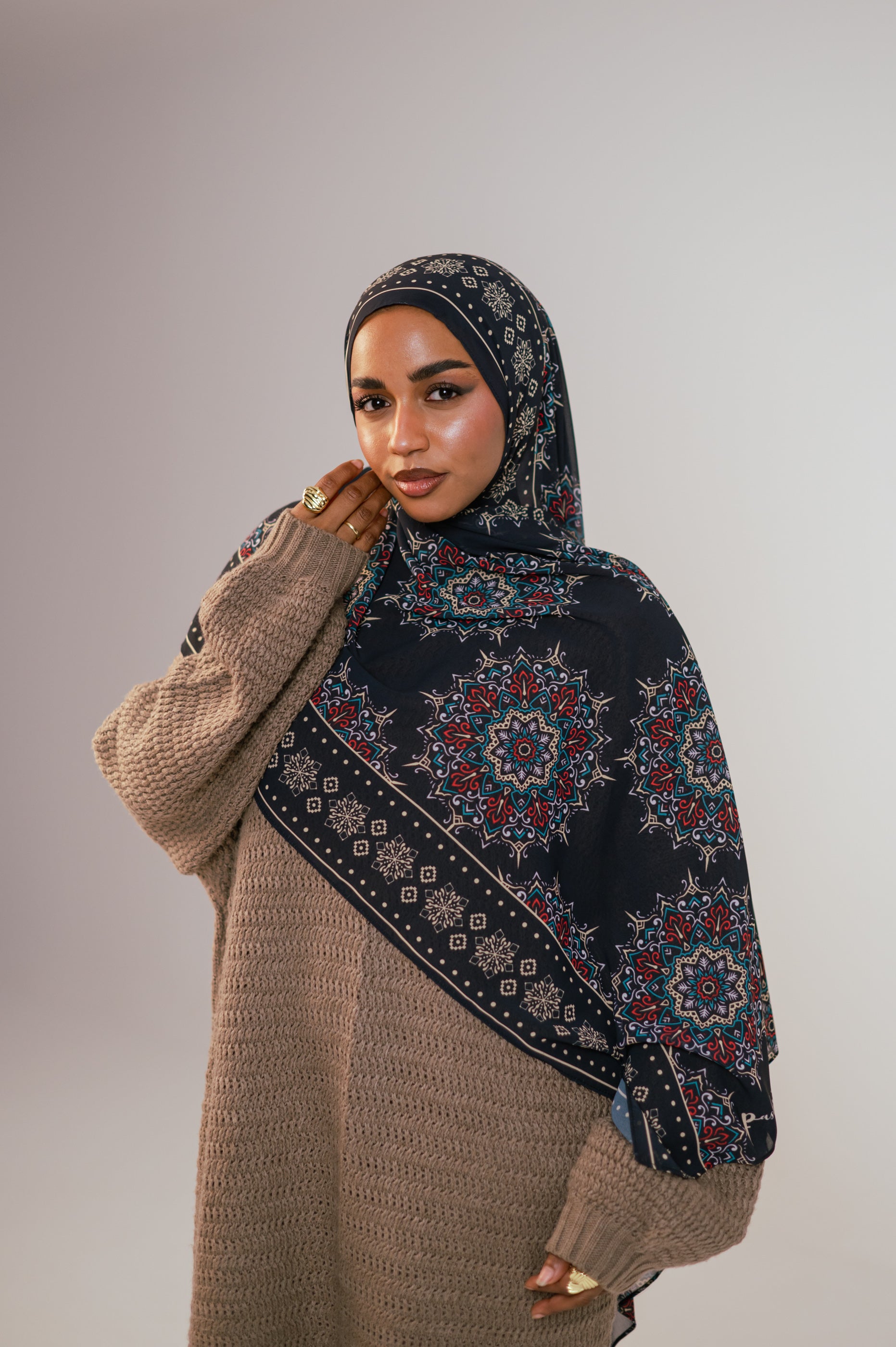 Model wearing the Andalusia Luxury Chiffon Hijab in a rich Andalusian medallion print, styled in a soft close-up showcasing the intricate pattern and elegant drape.