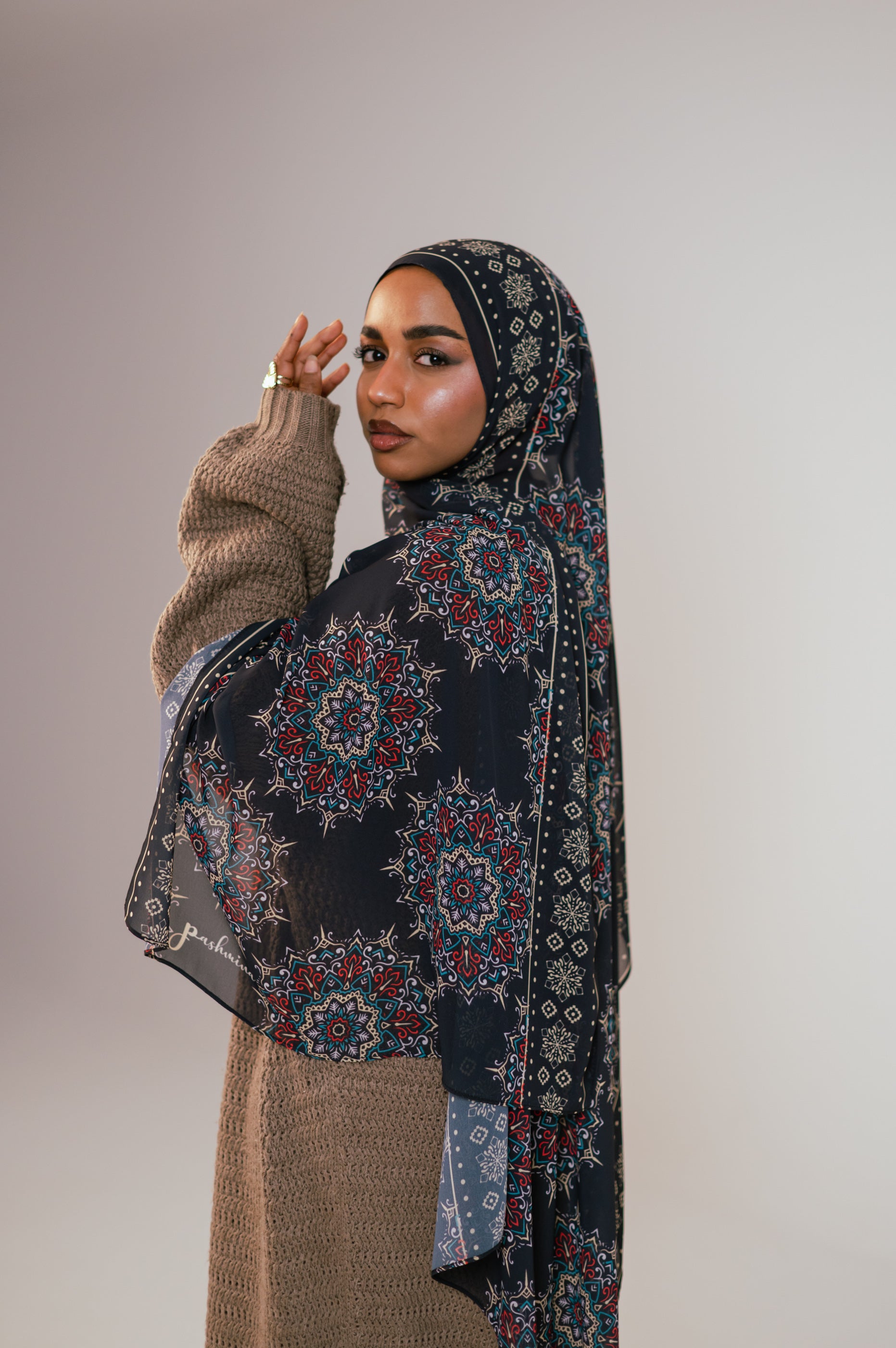 Model wearing the Andalusia Luxury Chiffon Hijab in a rich Andalusian medallion print, styled in a soft close-up showcasing the intricate pattern and elegant drape.