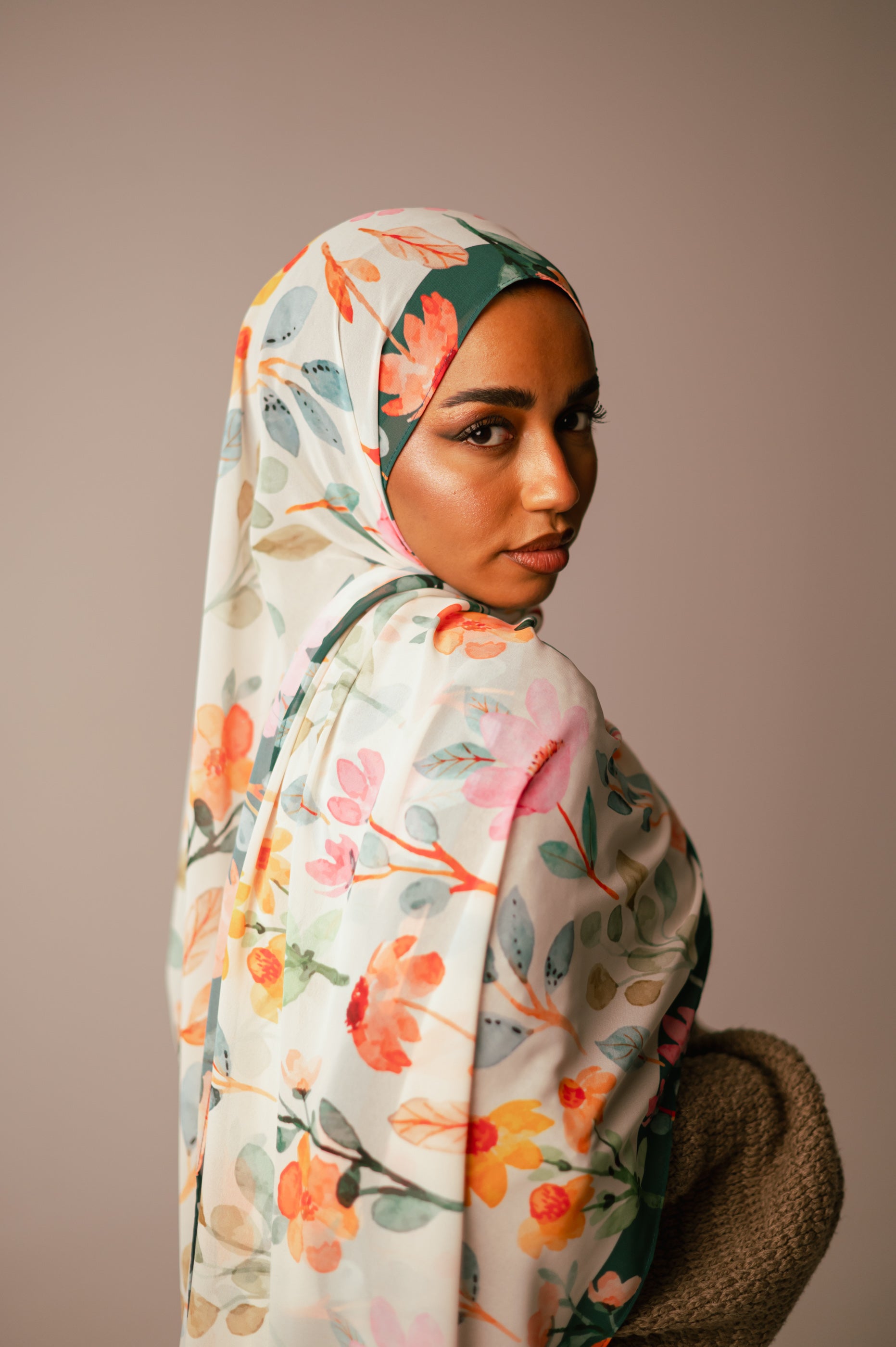 Back view of Blooms of Hope chiffon hijab showing full floral coverage and deep green border.