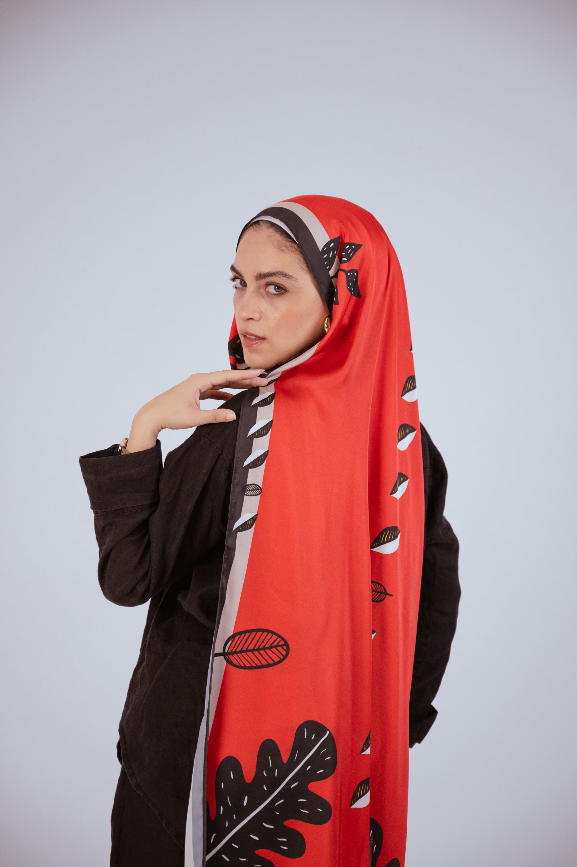 Elegant back view of the Bold Botanica satin hijab with a long flowing drape and bold leaf motifs.