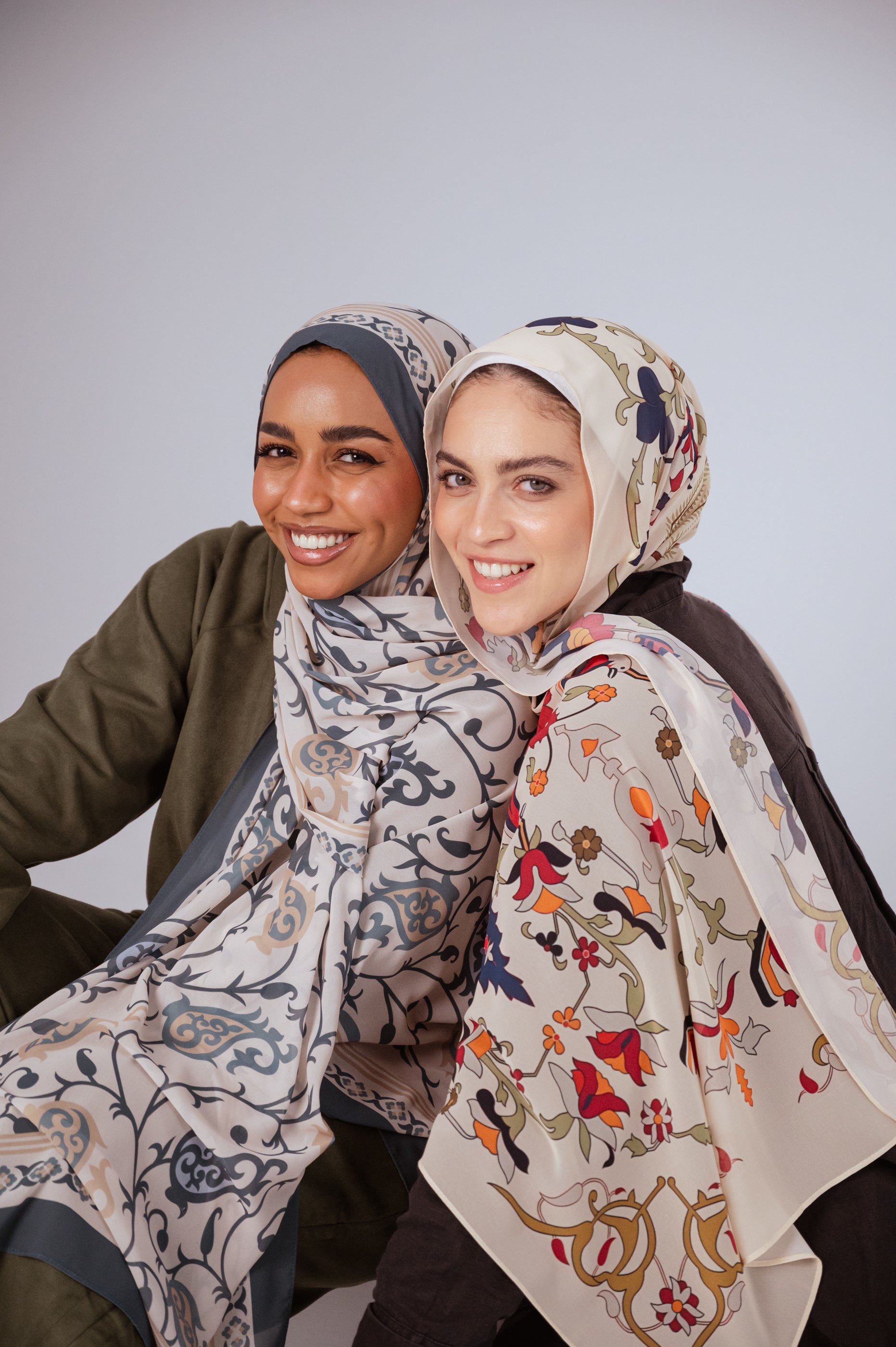 Model wearing Cordoba Serenity hijab in ivory, slate blue, and beige with Andalusian vine patterns.