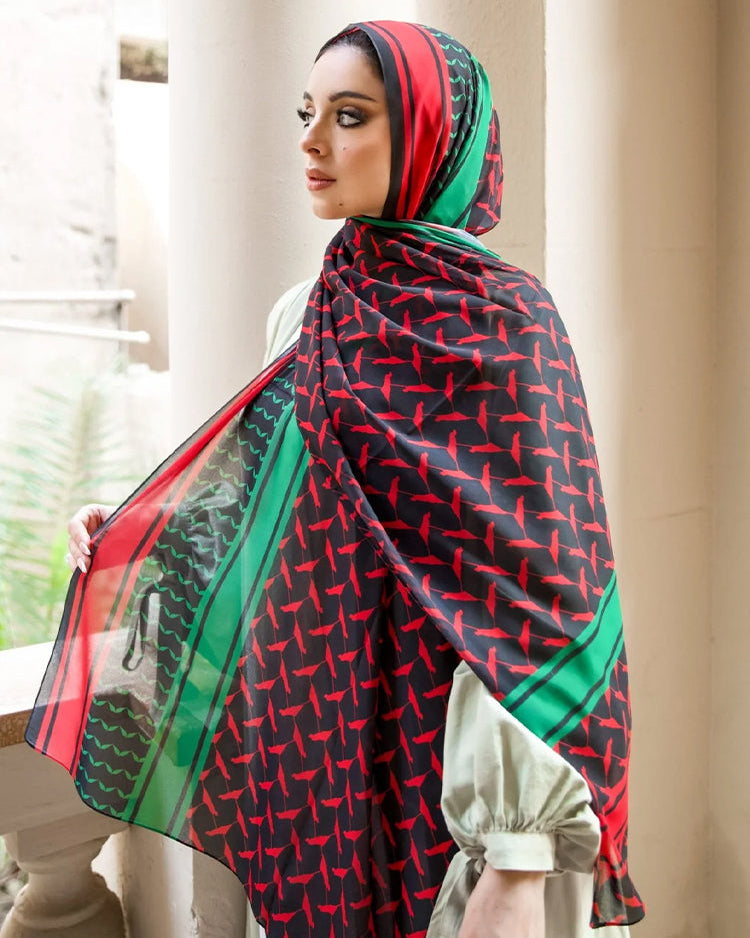 Side view of Genin hijab showing intricate flag-inspired pattern and elegant drape.