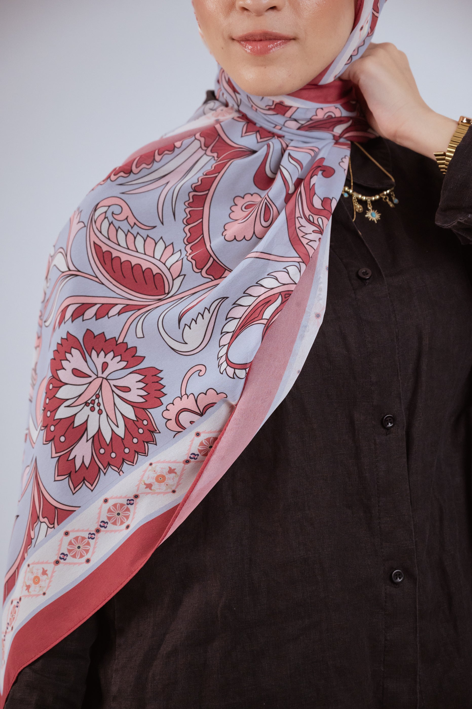 Close-up of Alhambra Bloom hijab showcasing Andalusian-inspired floral patterns.