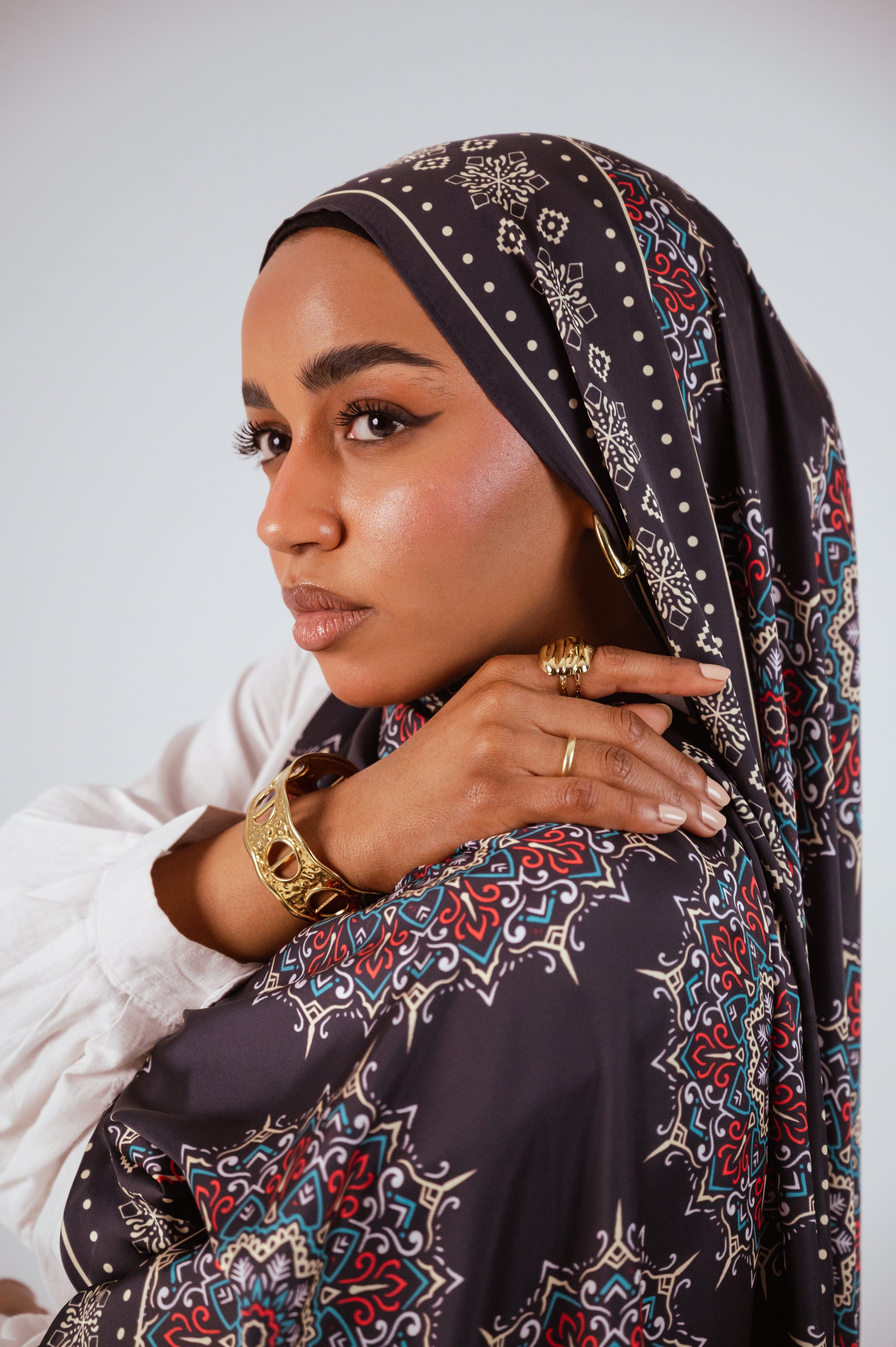 Detailed close-up of the Andalusia Satin Hijab fabric and print work.