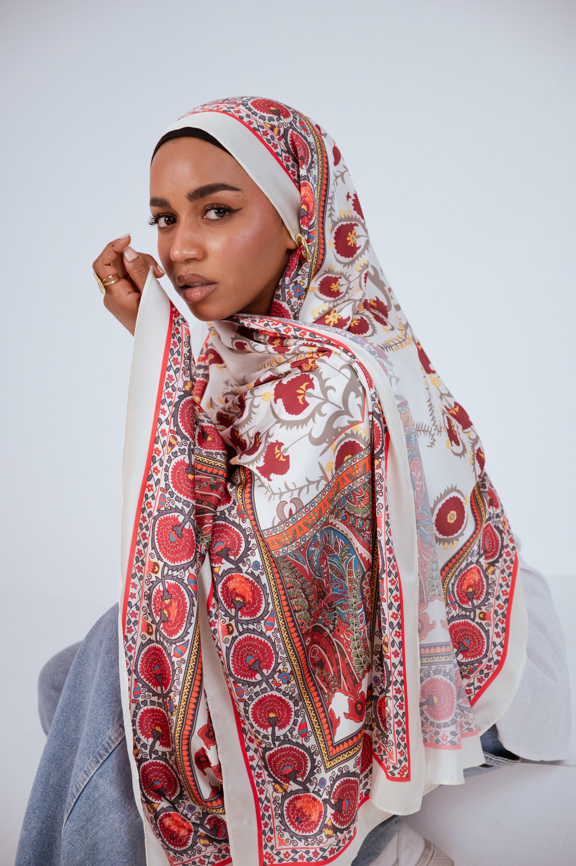 Soft portrait of model with Cairo Nights Satin Hijab, gold jewellery visible