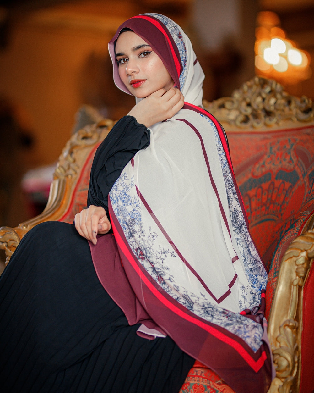 Model wearing Jaida Chateau Rouge chiffon hijab — luxury red floral hijab 200x70 cm