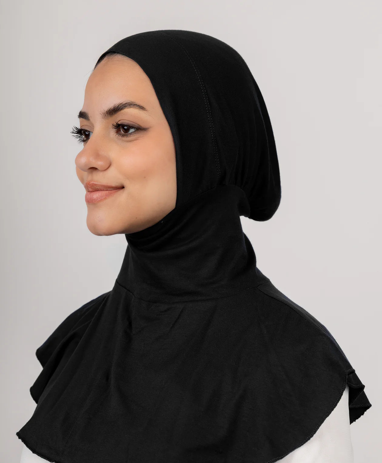 JAIDA Full Neck Underscarf in black cotton lycra, full neck undercap for modest layering and secure hijab base.