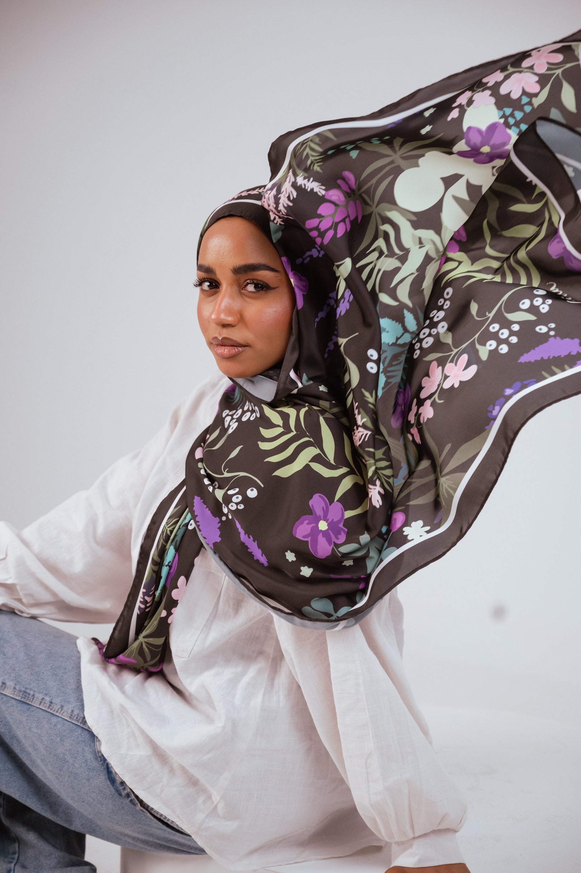Satin hijab flowing in motion with botanical print