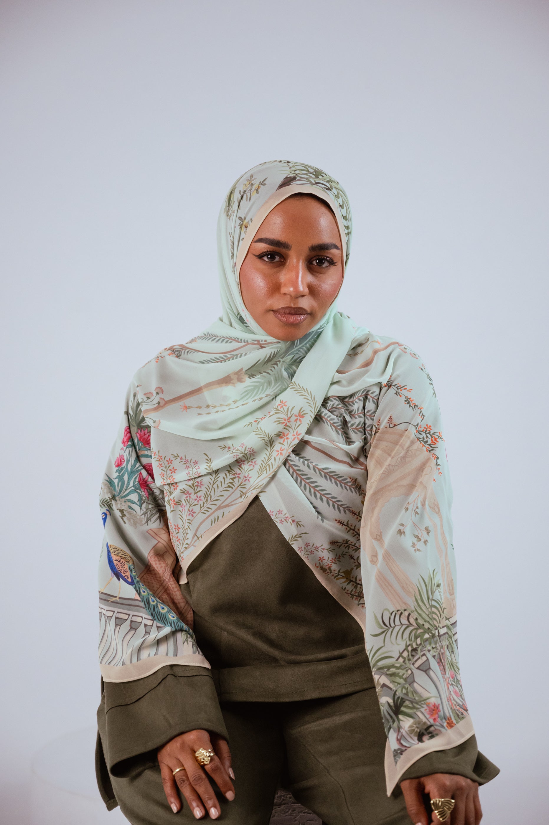 Model wearing Palais de Paon luxury chiffon hijab – mint peacock print by Jaida