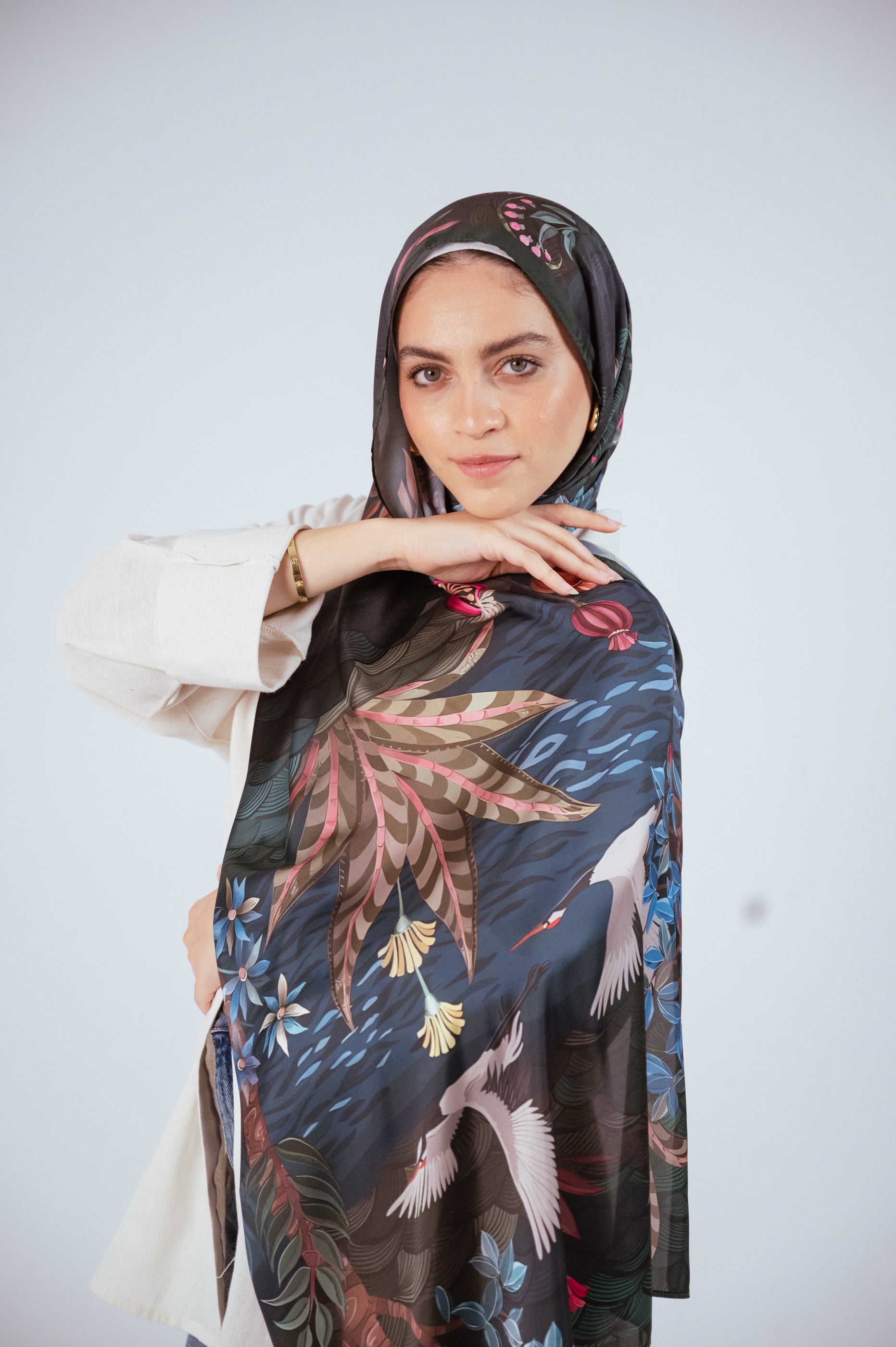 Model wearing the Secret Garden Satin Hijab, front pose showing main print.