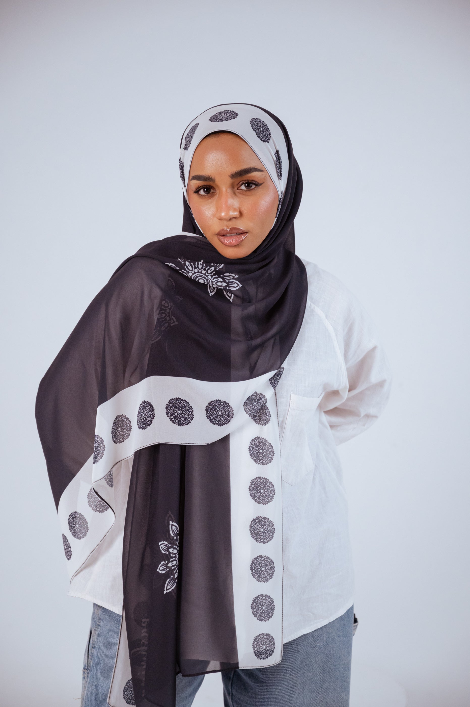 Midnight Mandala chiffon hijab styled in a classic wrap, charcoal with mandala detailing.