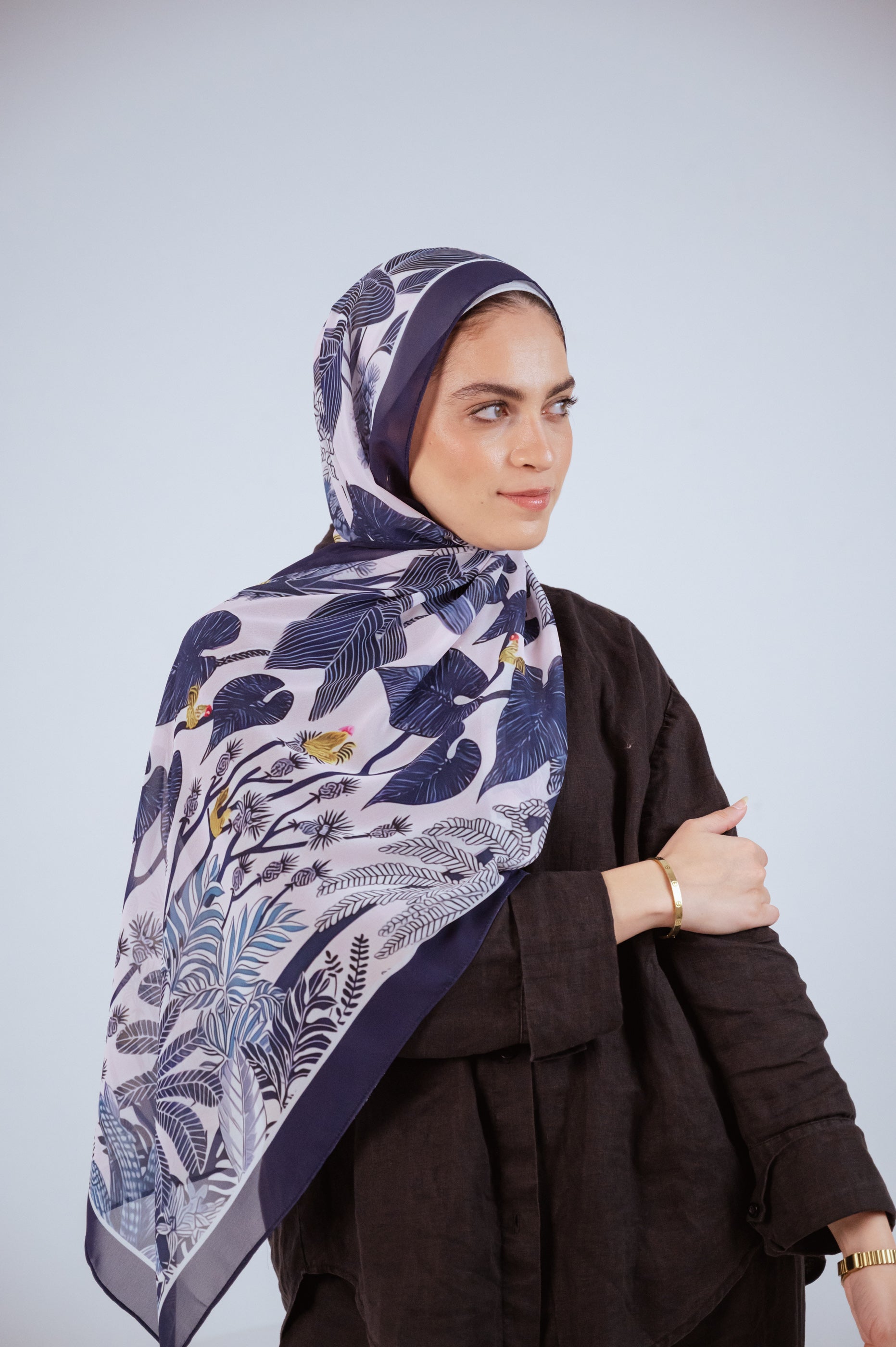Model wearing Moonlight Oasis chiffon hijab – front view with navy and silver botanical print