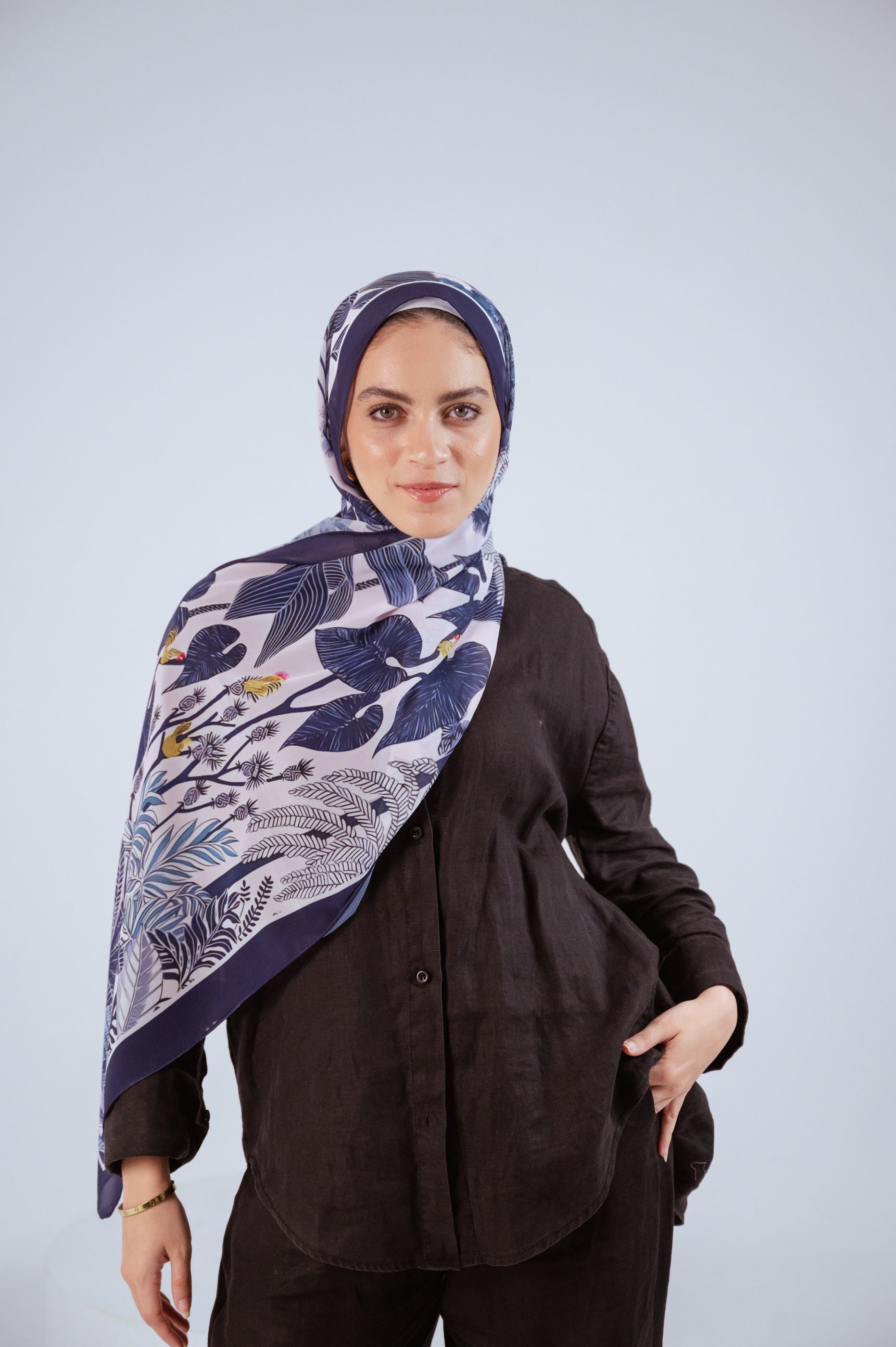 Model wearing Moonlight Oasis chiffon hijab – front view with navy and silver botanical print