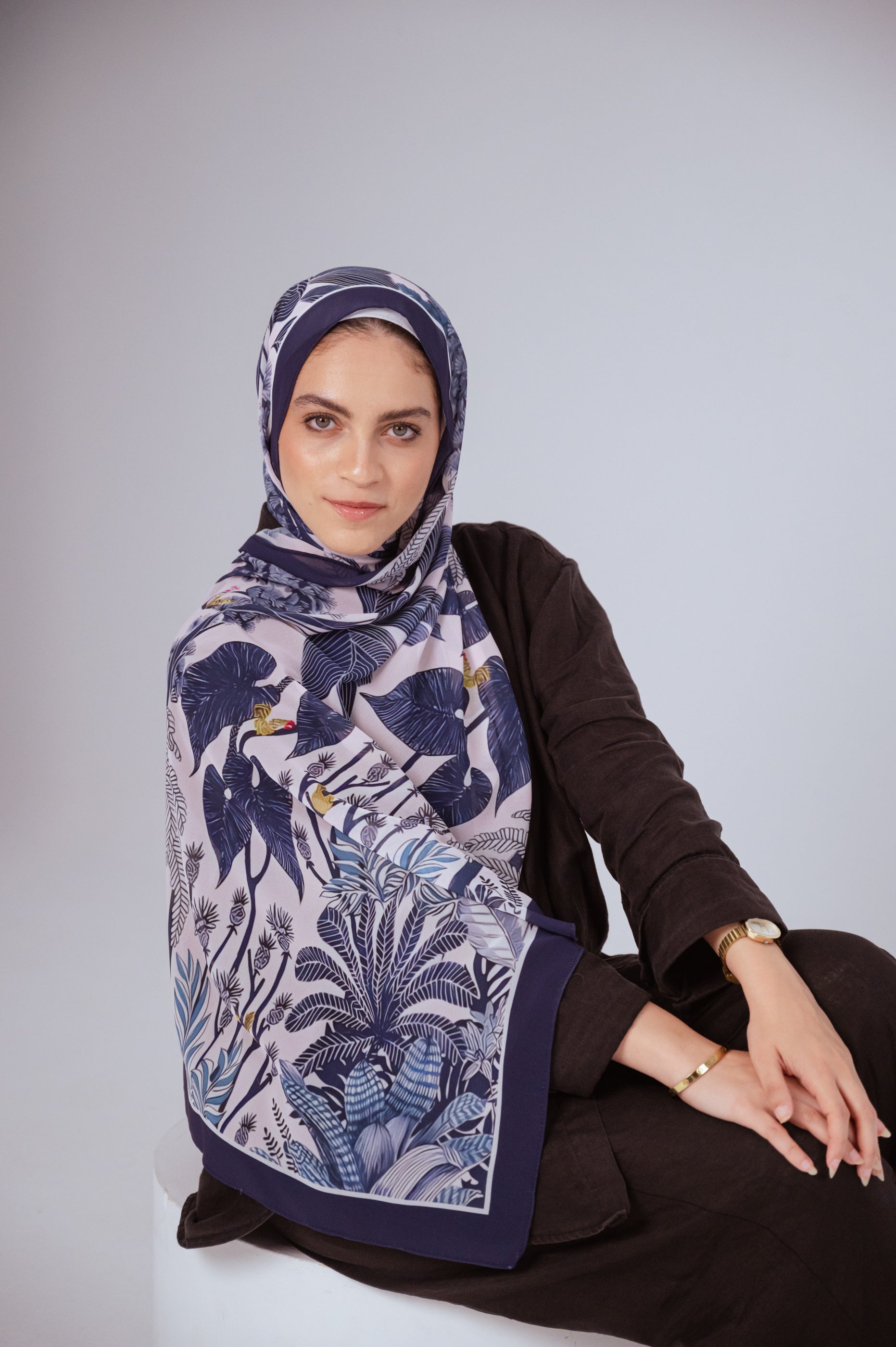Model wearing Moonlight Oasis chiffon hijab – front view with navy and silver botanical print