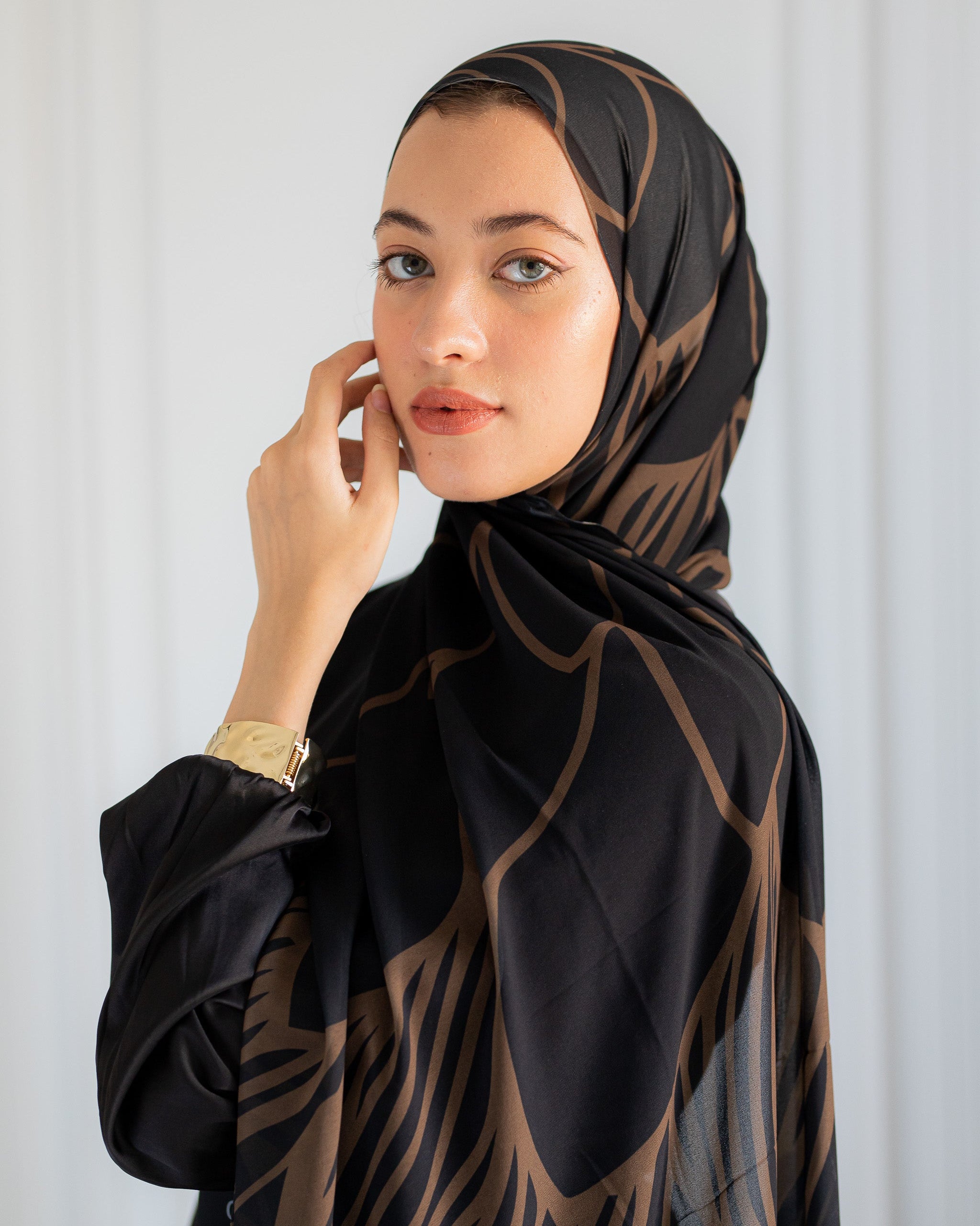 Close-up of Night Dunes Hijab – Bronze Lines on Black Chiffon