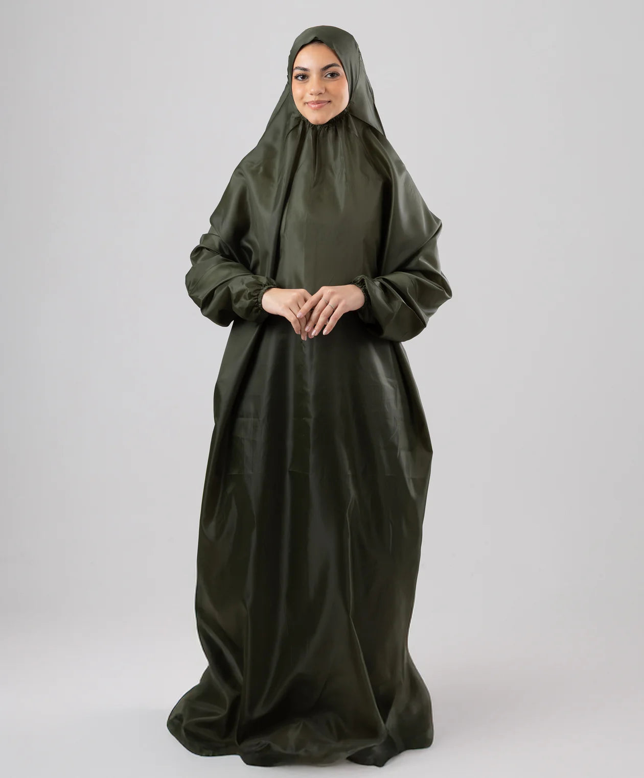 Black portable prayer isdal worn by a model, one-piece drape from head to ankle — JAIDA