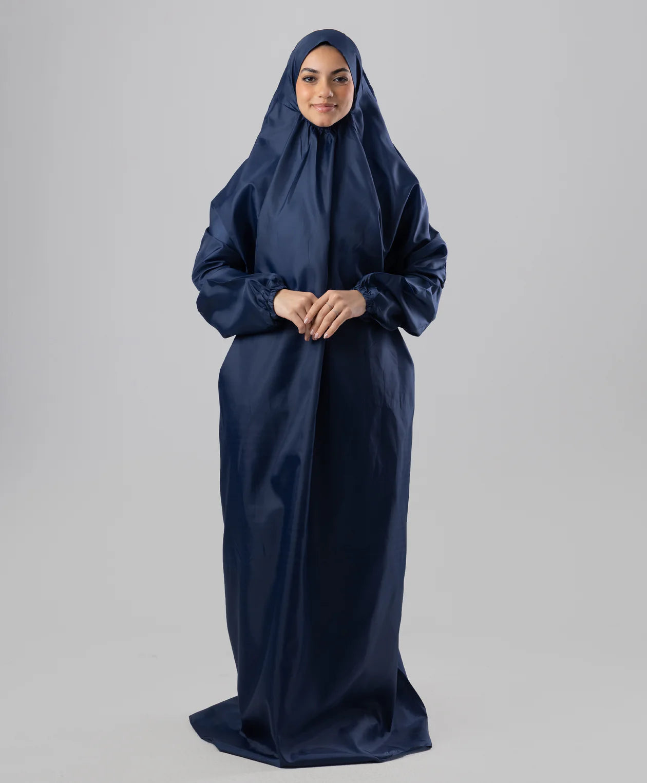 Olive portable prayer isdal worn by a model, loose one-piece cut head to ankle — JAIDA