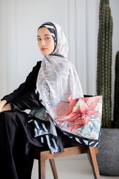 Model wearing Jaida’s Roselle Canvas Luxury Chiffon Hijab, highlighting its painterly floral design and airy chiffon texture.