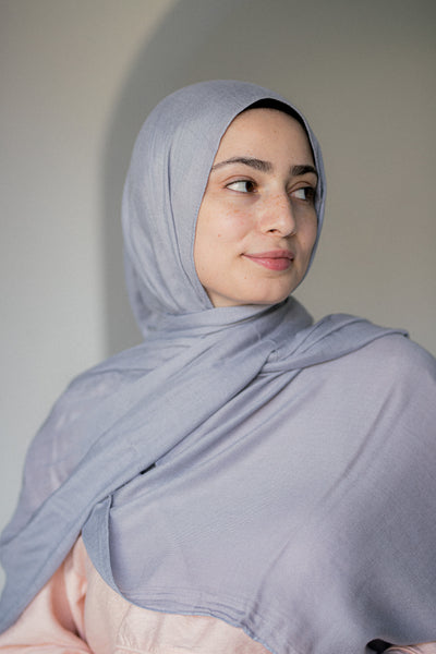 Moonstone Modal Cotton Hijab in motion – showcasing its fluid drape and soft misty hue under natural light