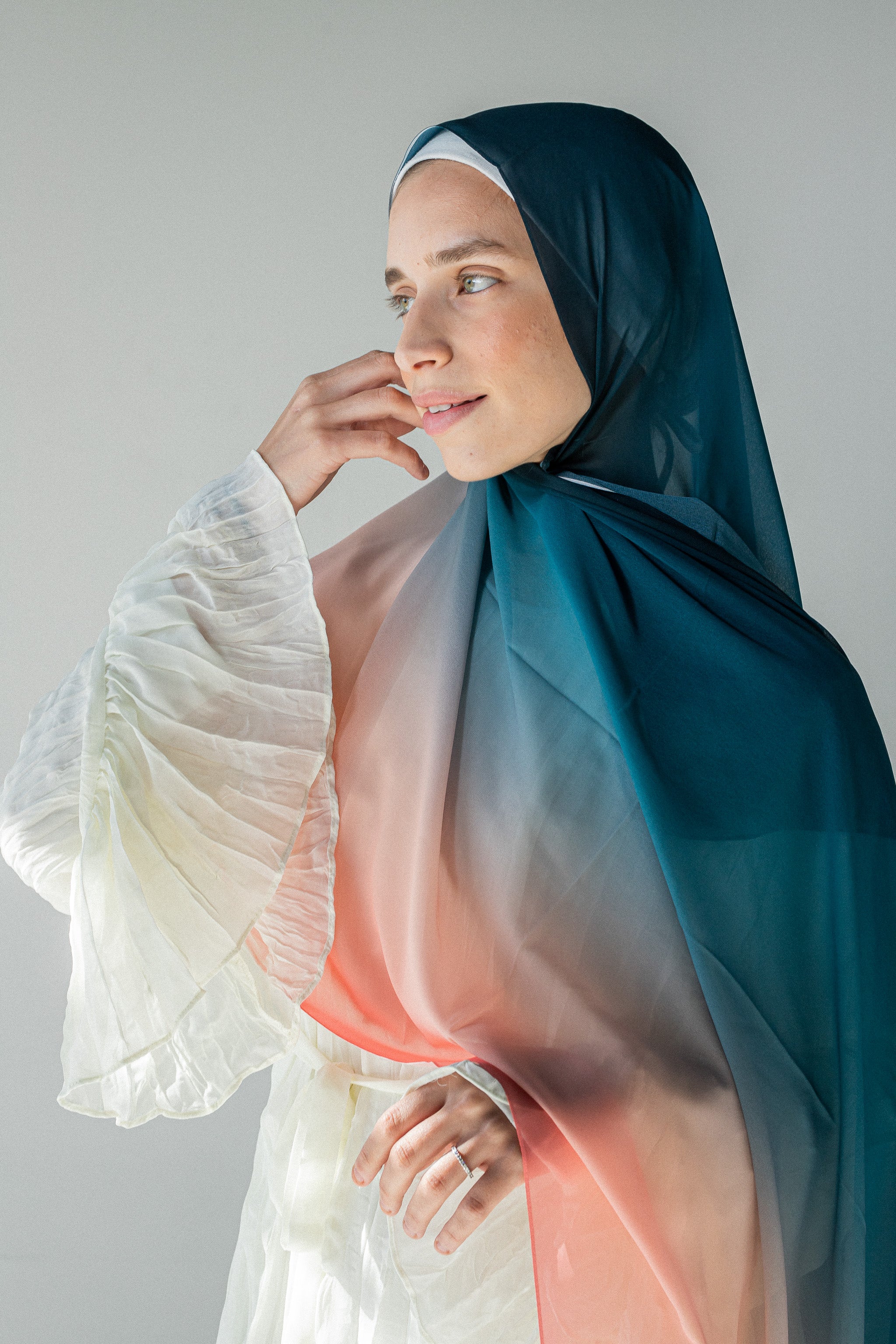 Three models Draping radiant edit luxury chiffon hijabs including coral horizon