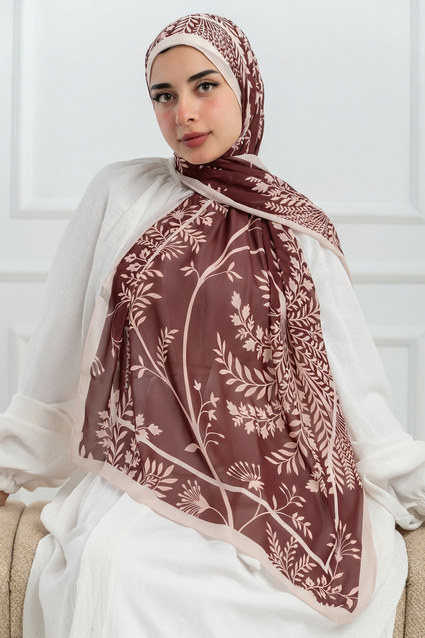 Model wearing Rose of Petra luxury chiffon hijab – front view with rose and blush botanical design