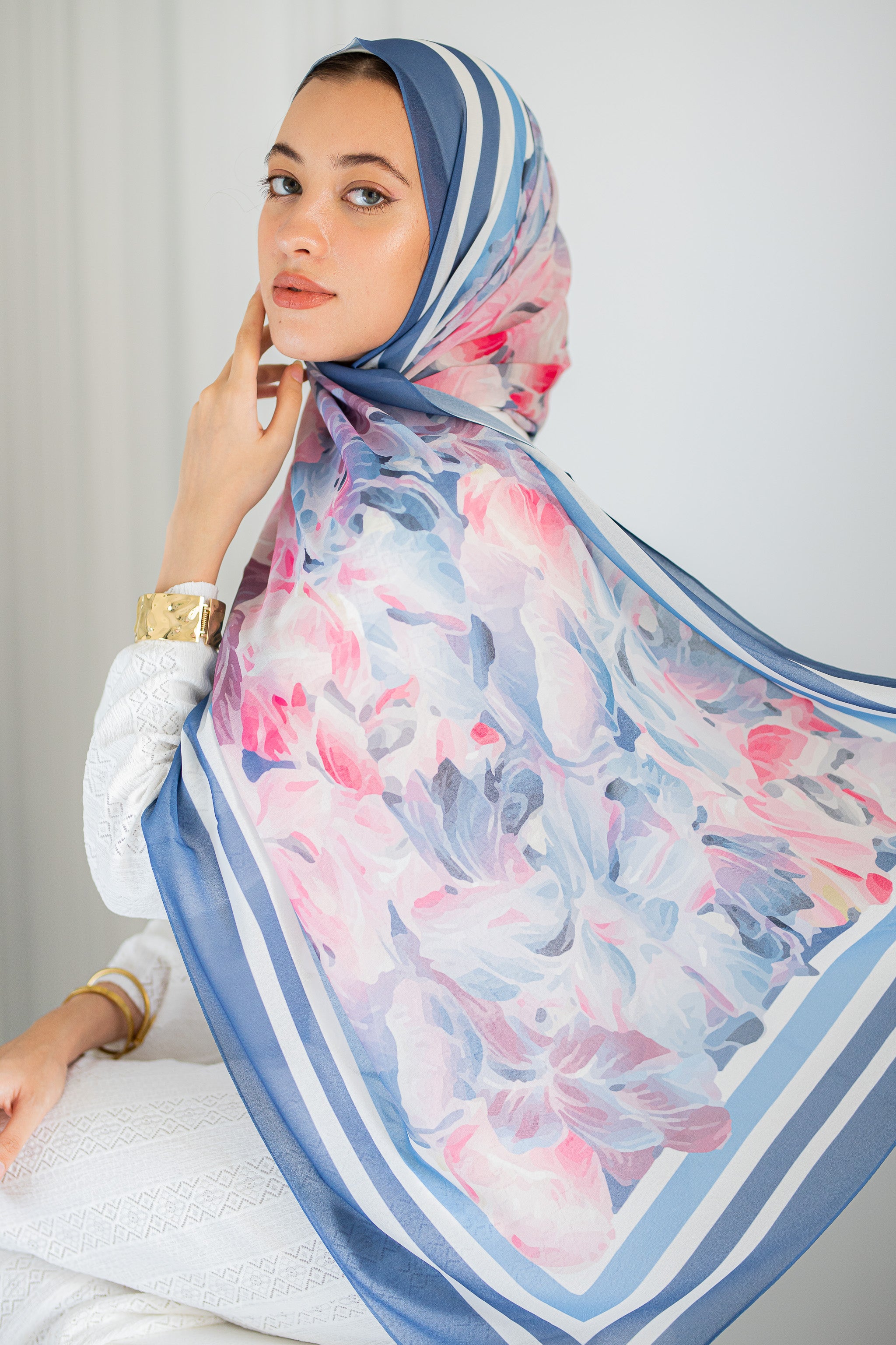 Model wearing Rose Petal Gelato chiffon hijab – soft pink and blue floral design