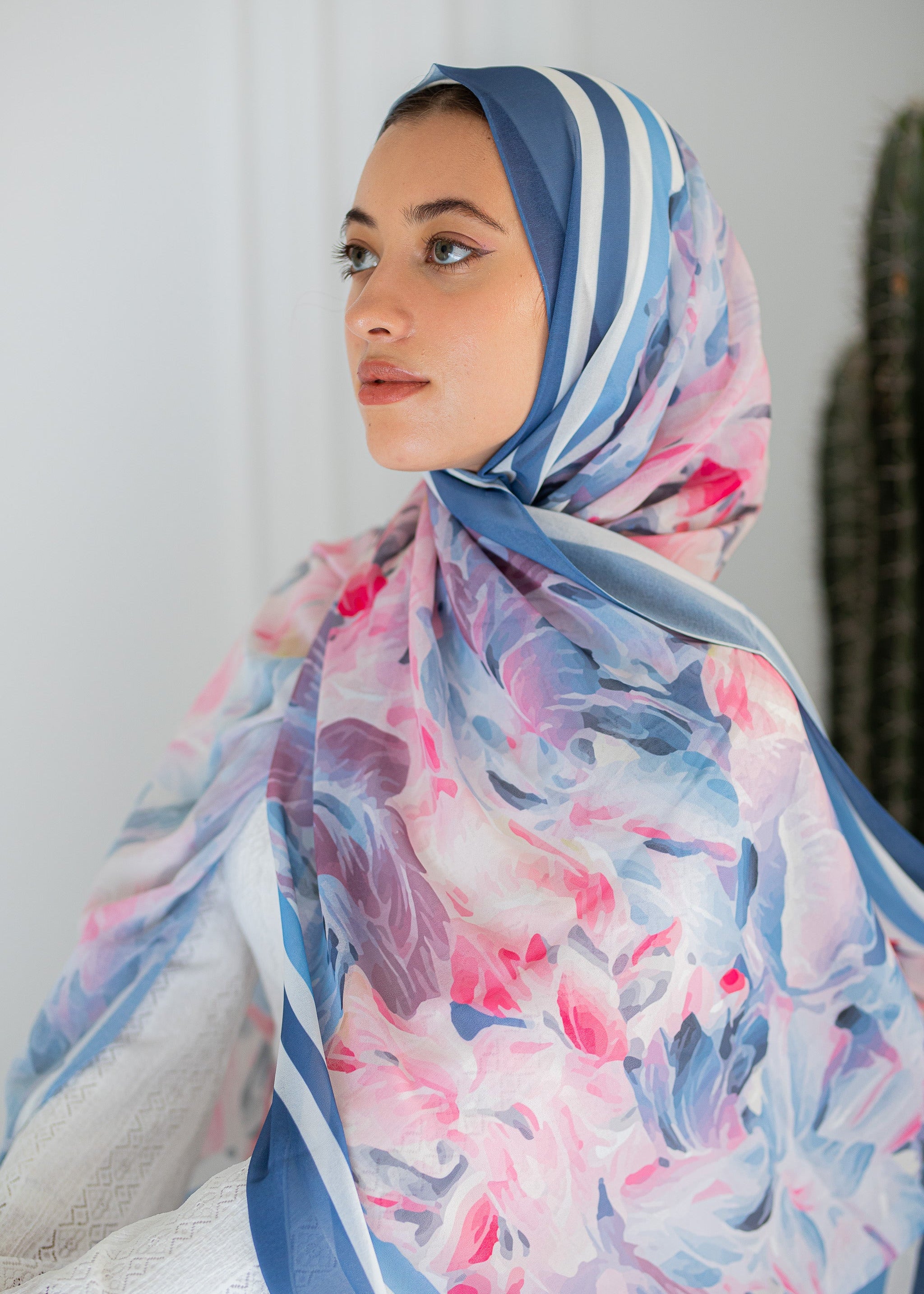 Model wearing Rose Petal Gelato chiffon hijab – soft pink and blue floral design
