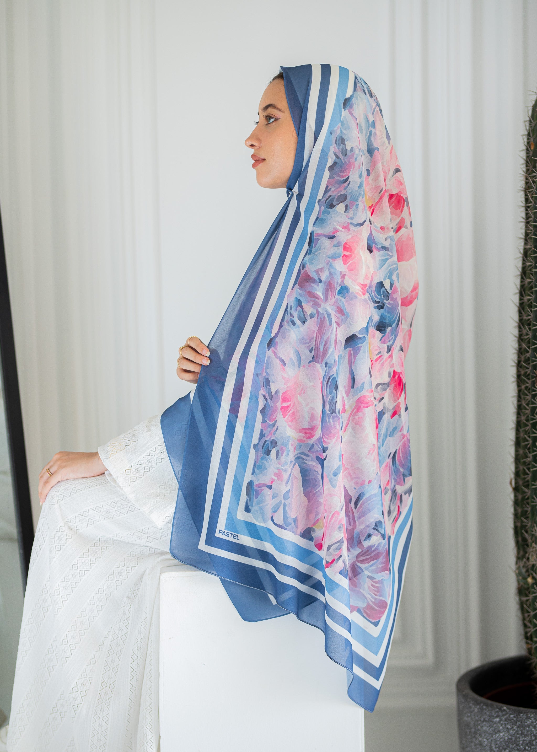 Model wearing Rose Petal Gelato chiffon hijab – soft pink and blue floral design