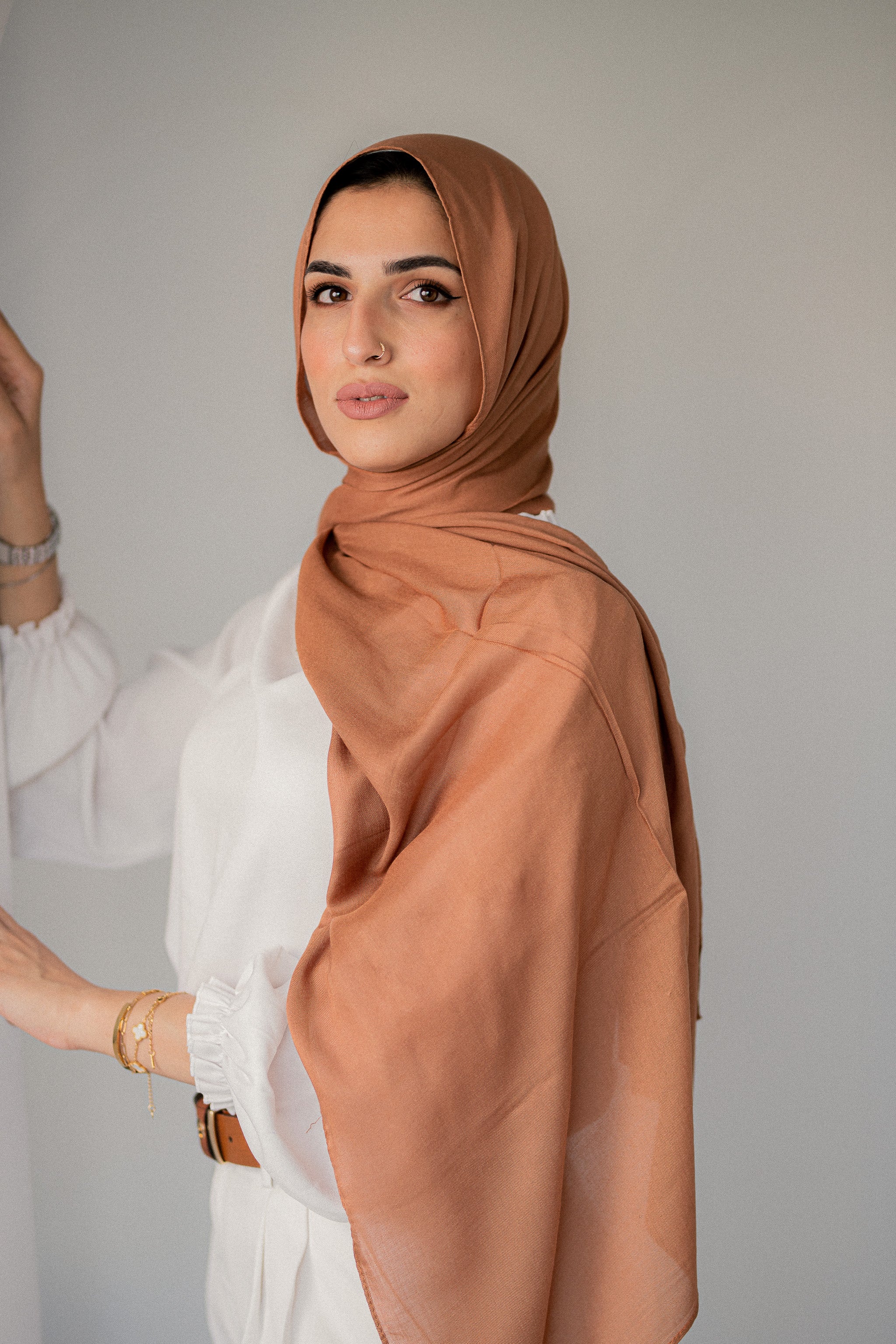 Side view of Sahara Dusk hijab styled loosely, highlighting elegant drape and texture.
